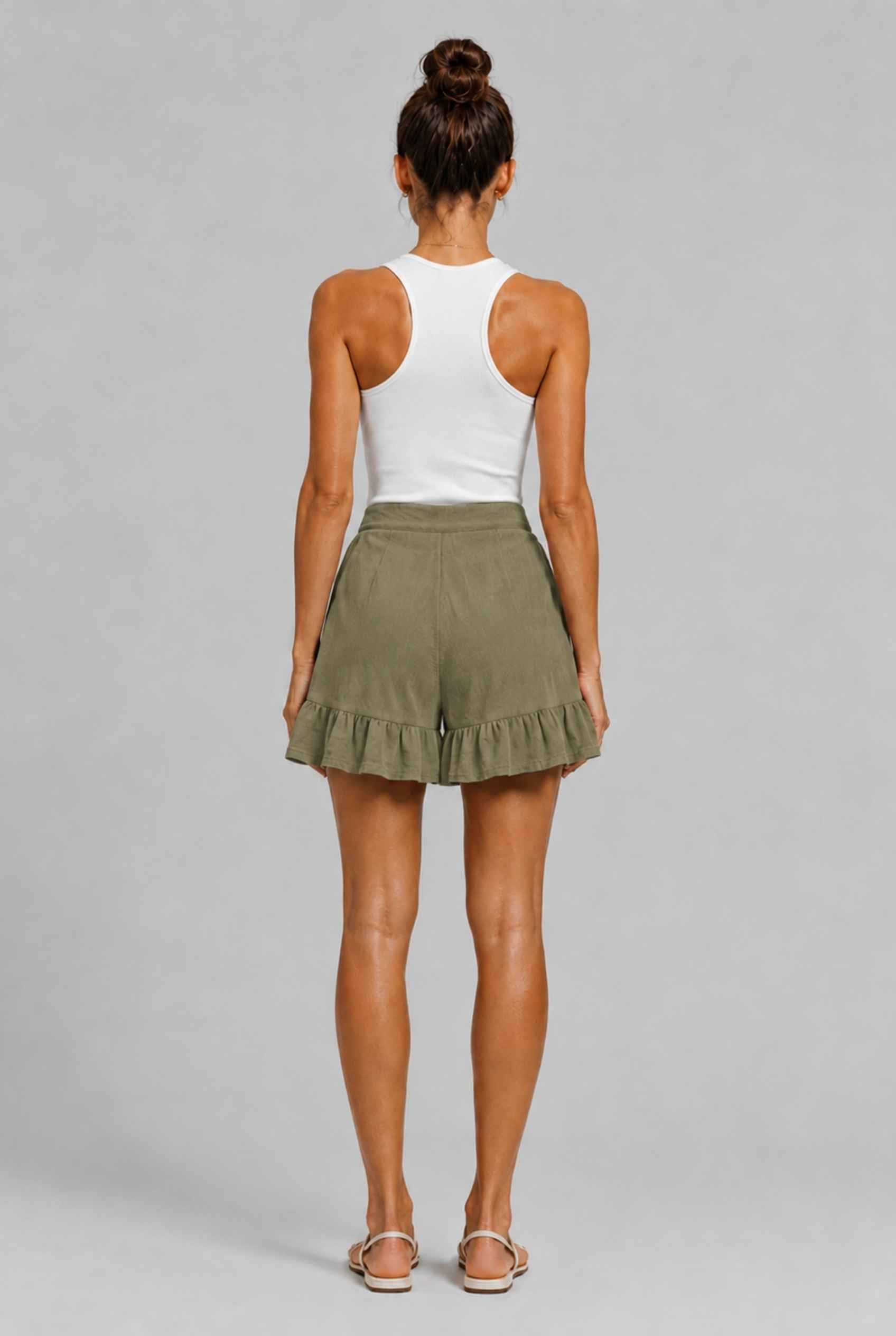 Virtual Model Wearing The Nerina Ruffle Short Dark Green High-Waisted Wide-Leg Ruffle Hem Shorts
