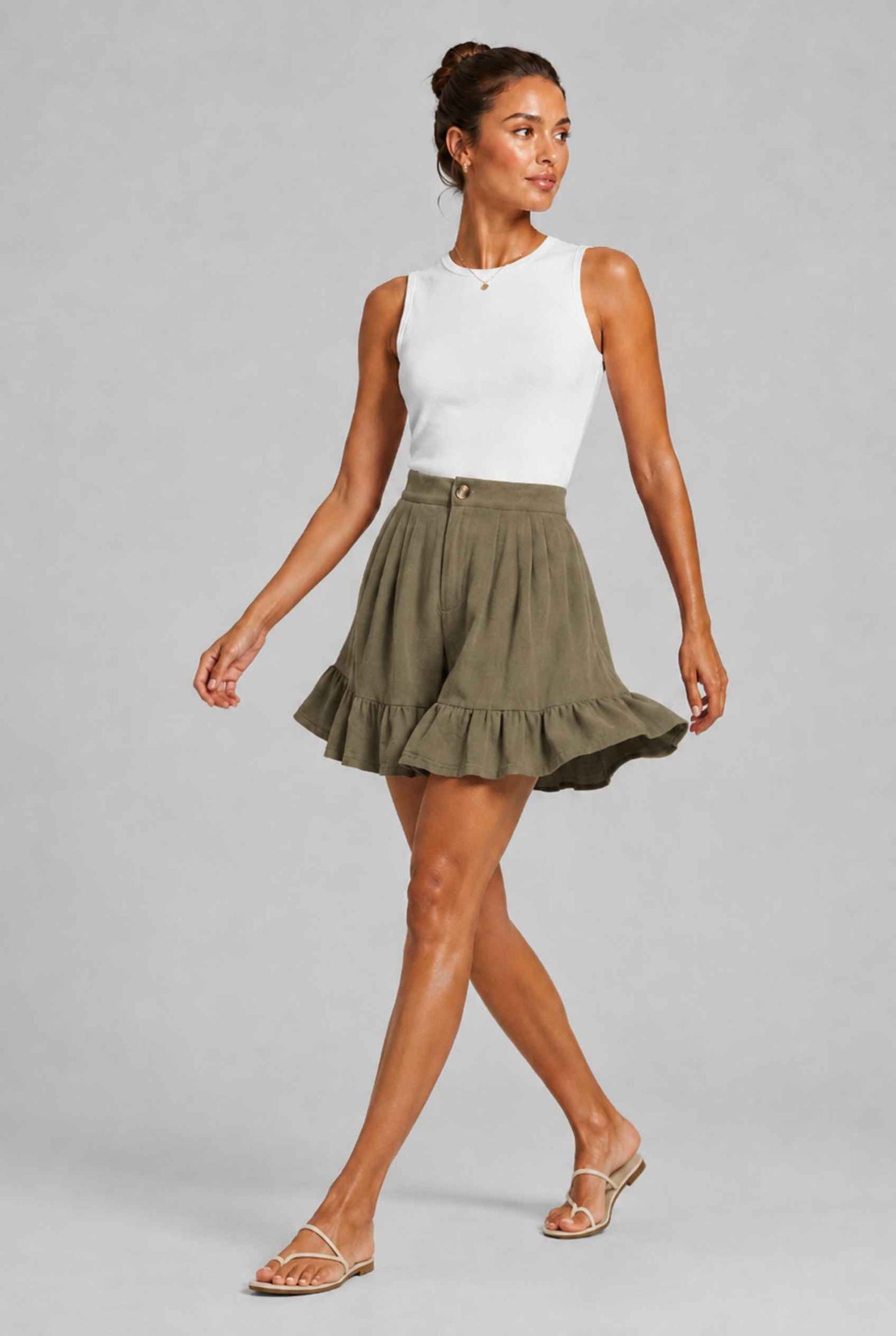 Virtual Model Wearing The Nerina Ruffle Short Dark Green High-Waisted Wide-Leg Ruffle Hem Shorts