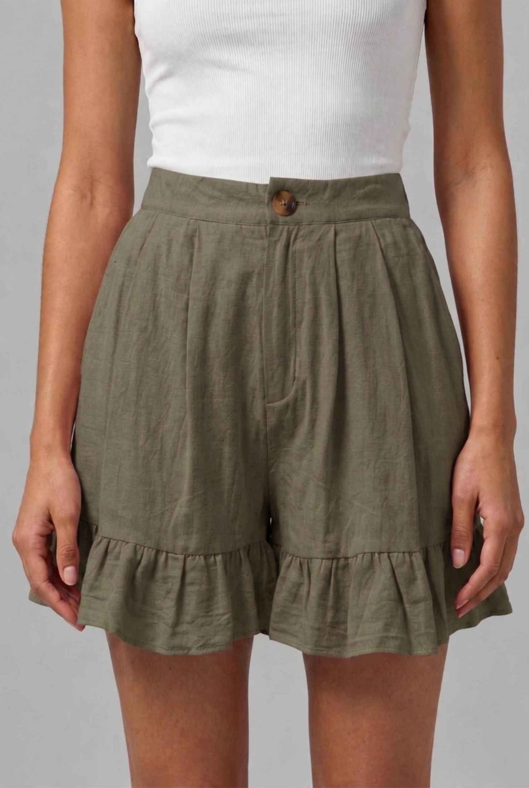 Virtual Model Wearing The Nerina Ruffle Short Dark Green High-Waisted Wide-Leg Ruffle Hem Shorts