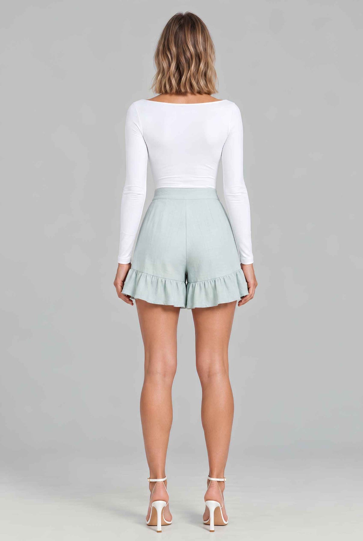 Virtual model wearing The Nerina Ruffle Short High-Waisted Wide-Leg Ruffle Hem Shorts Mint