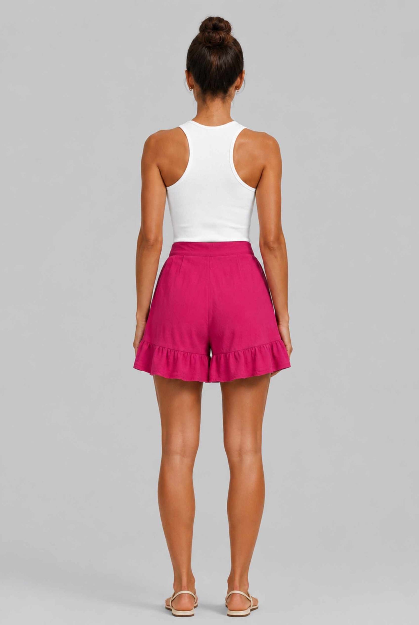 Virtual Model Wearing The Nerina Ruffle Short Pink High-Waisted Wide-Leg Ruffle Hem Shorts