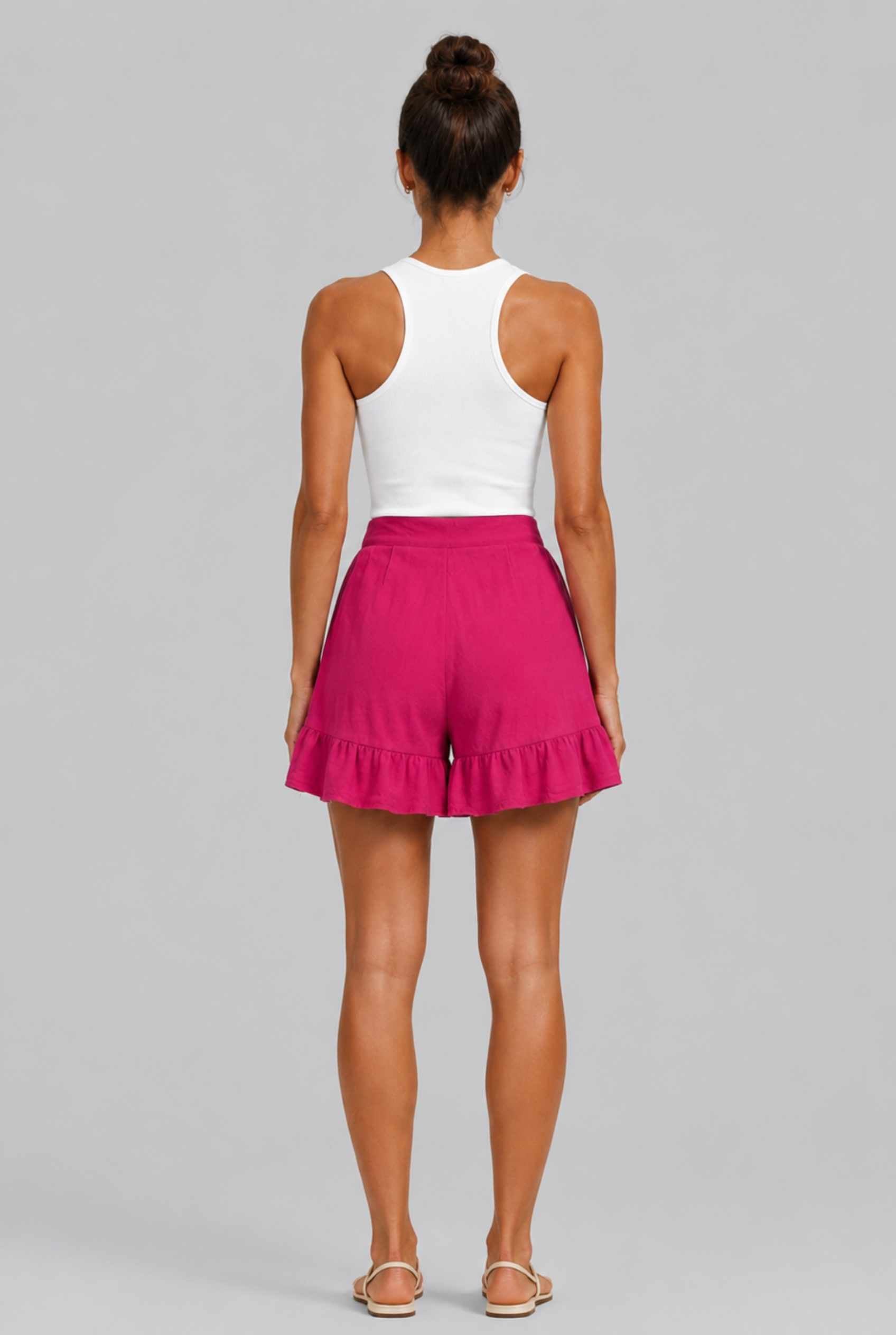 Virtual Model Wearing The Nerina Ruffle Short Pink High-Waisted Wide-Leg Ruffle Hem Shorts