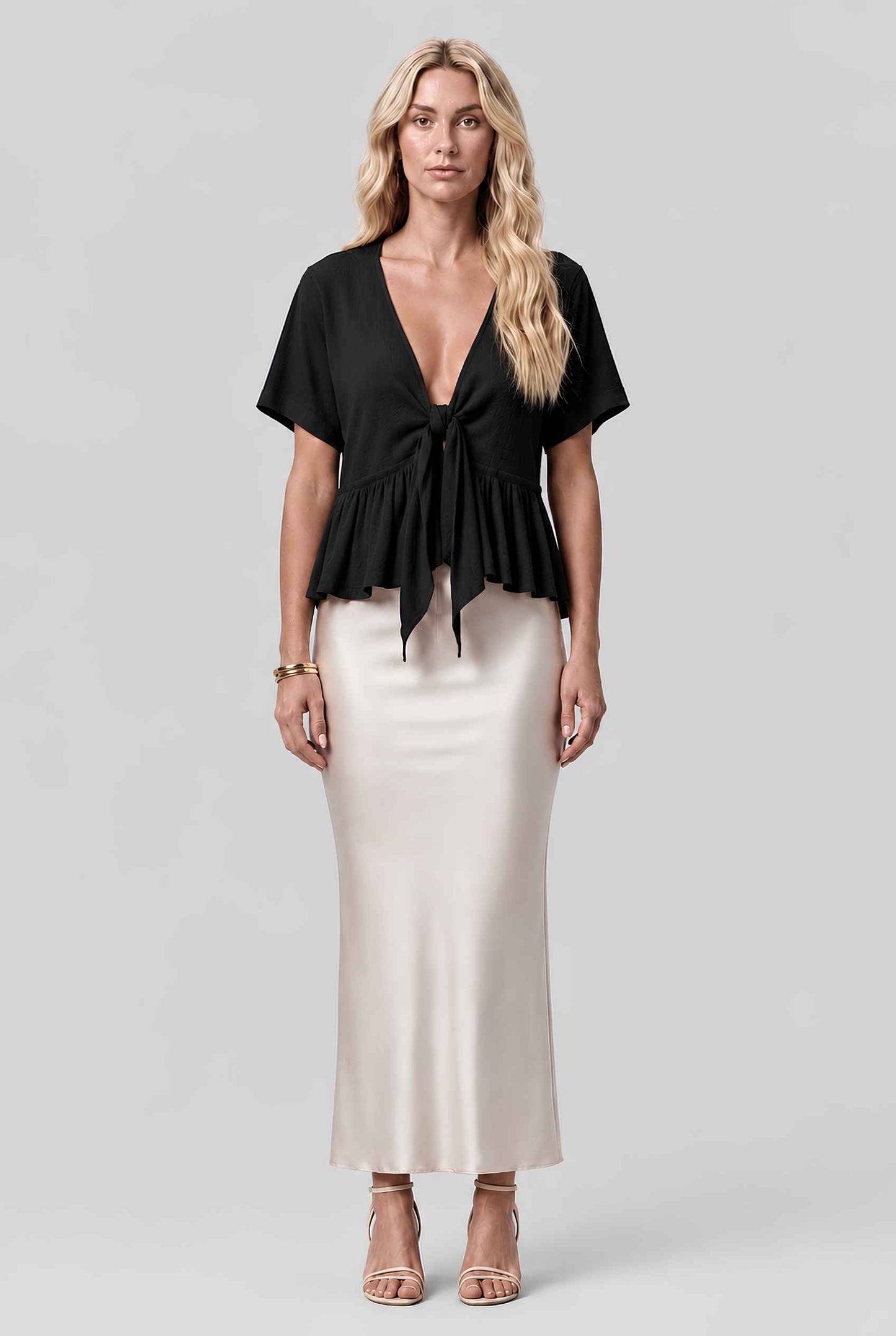 Virtual model wearing The Paloma Tied Peplum Top Cotton Slub Tie-Front Top in Black