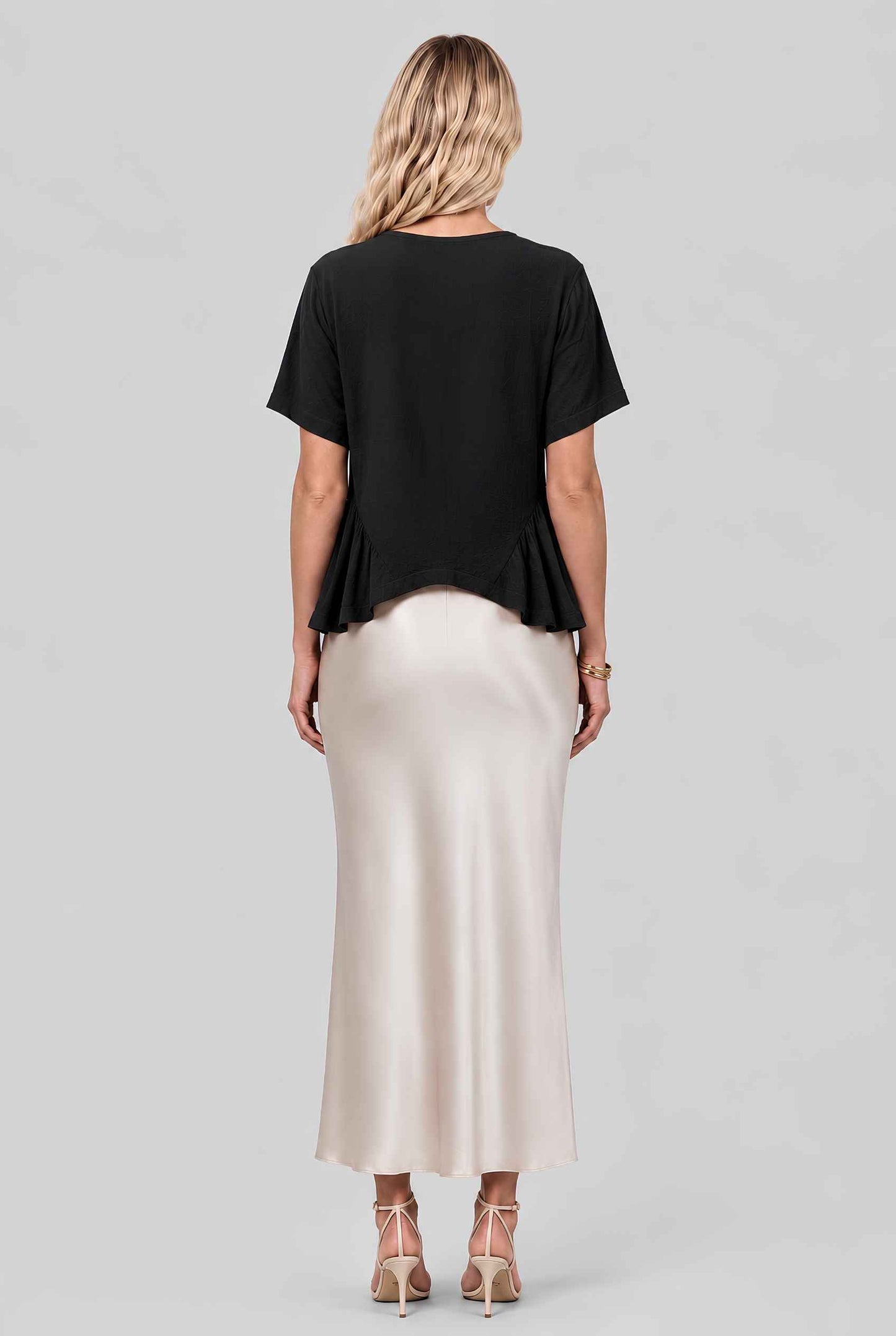 Virtual model wearing The Paloma Tied Peplum Top Cotton Slub Tie-Front Top in Black