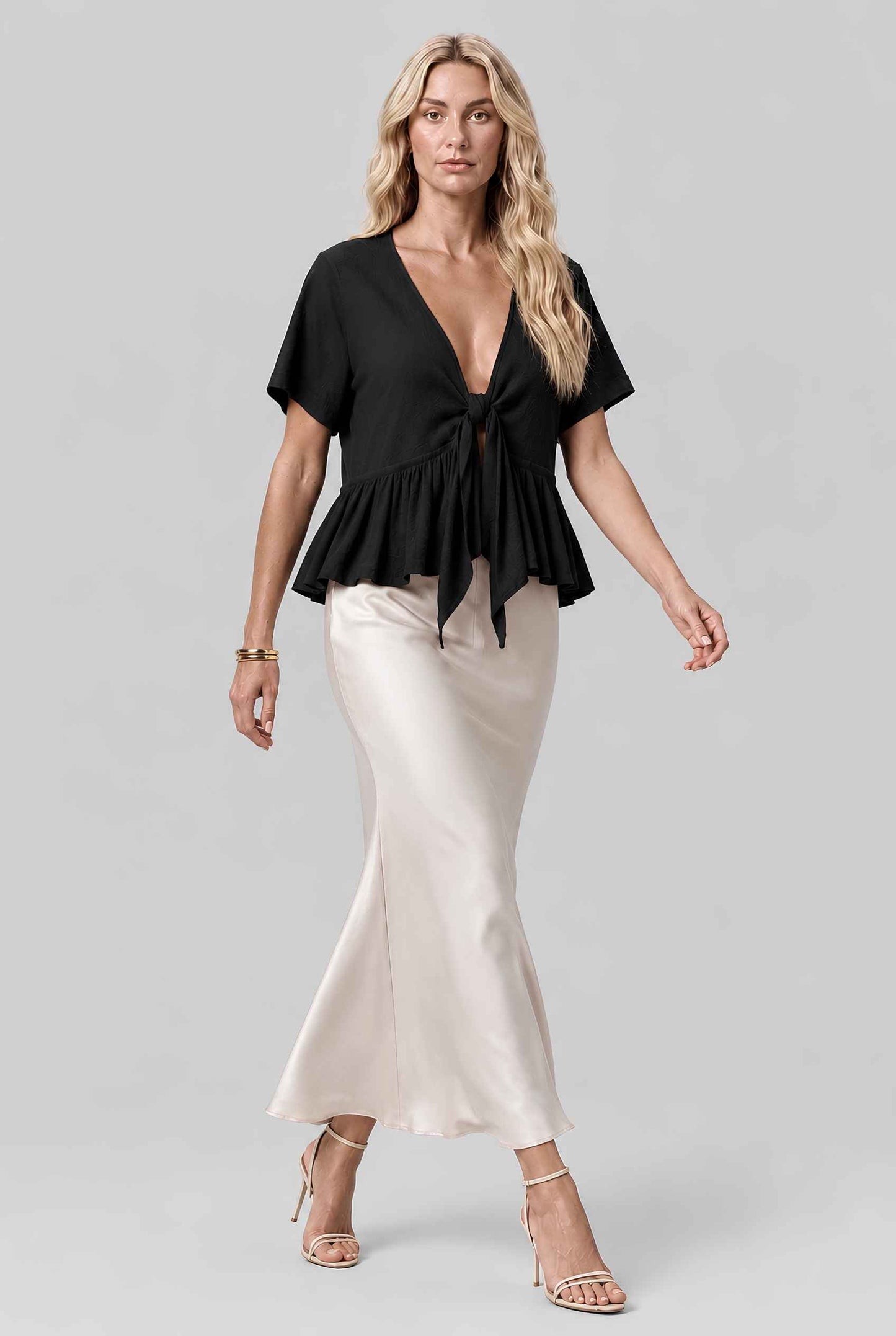 Virtual model wearing The Paloma Tied Peplum Top Cotton Slub Tie-Front Top in Black