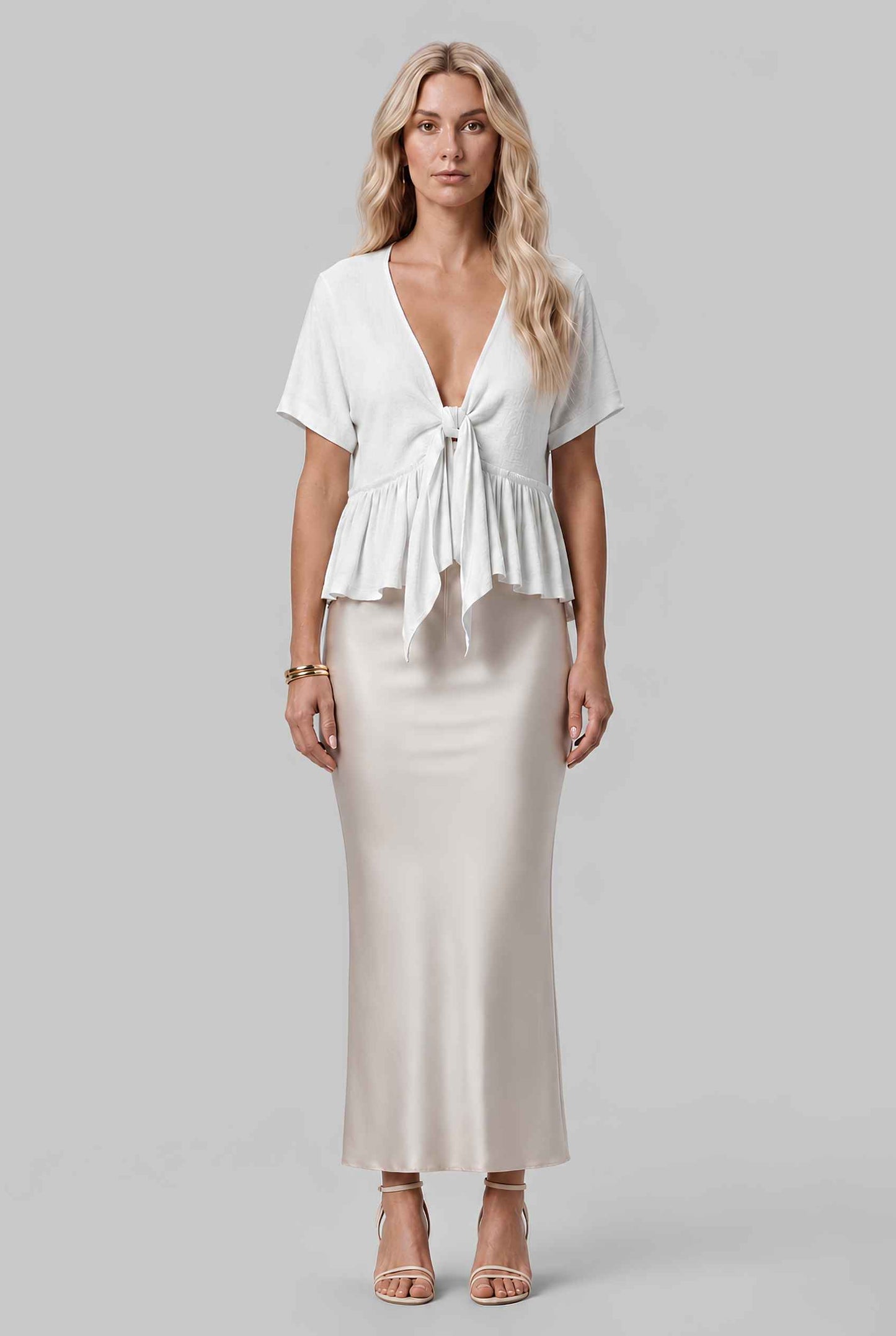 Virtual model wearing The Paloma Tied Peplum Top Cotton Slub Tie-Front Top in White