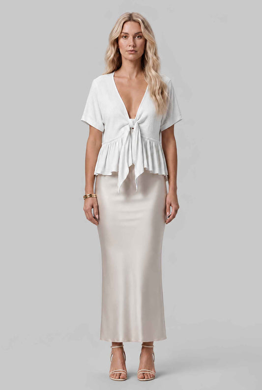 Virtual model wearing The Paloma Tied Peplum Top Cotton Slub Tie-Front Top in White