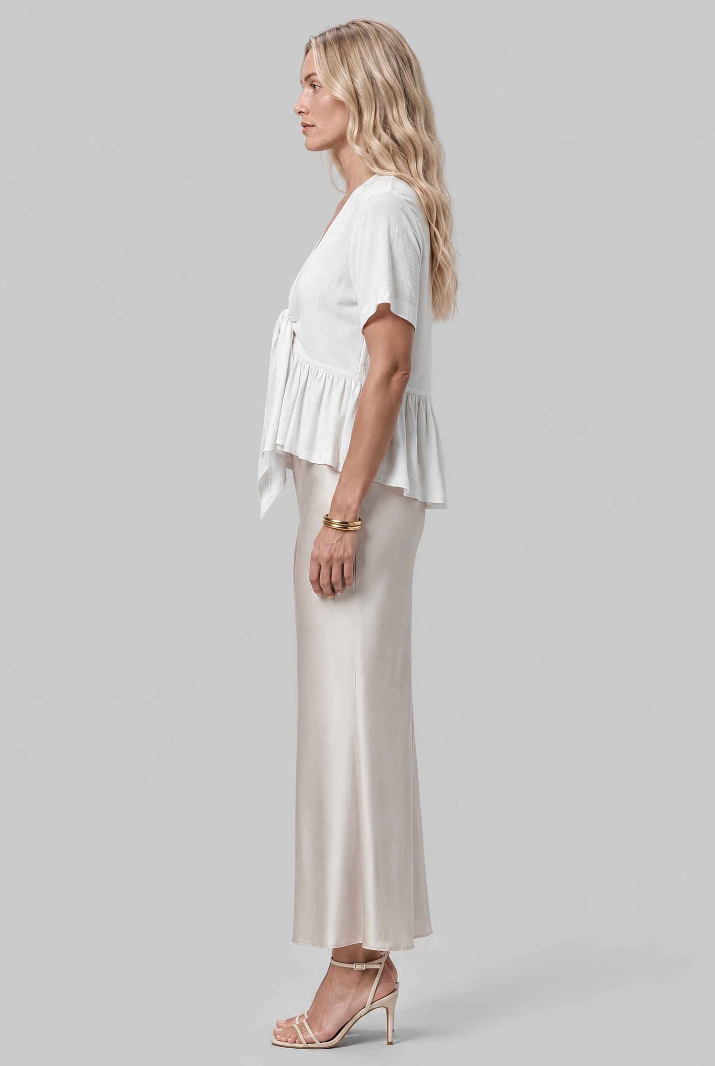 Virtual model wearing The Paloma Tied Peplum Top Cotton Slub Tie-Front Top in White