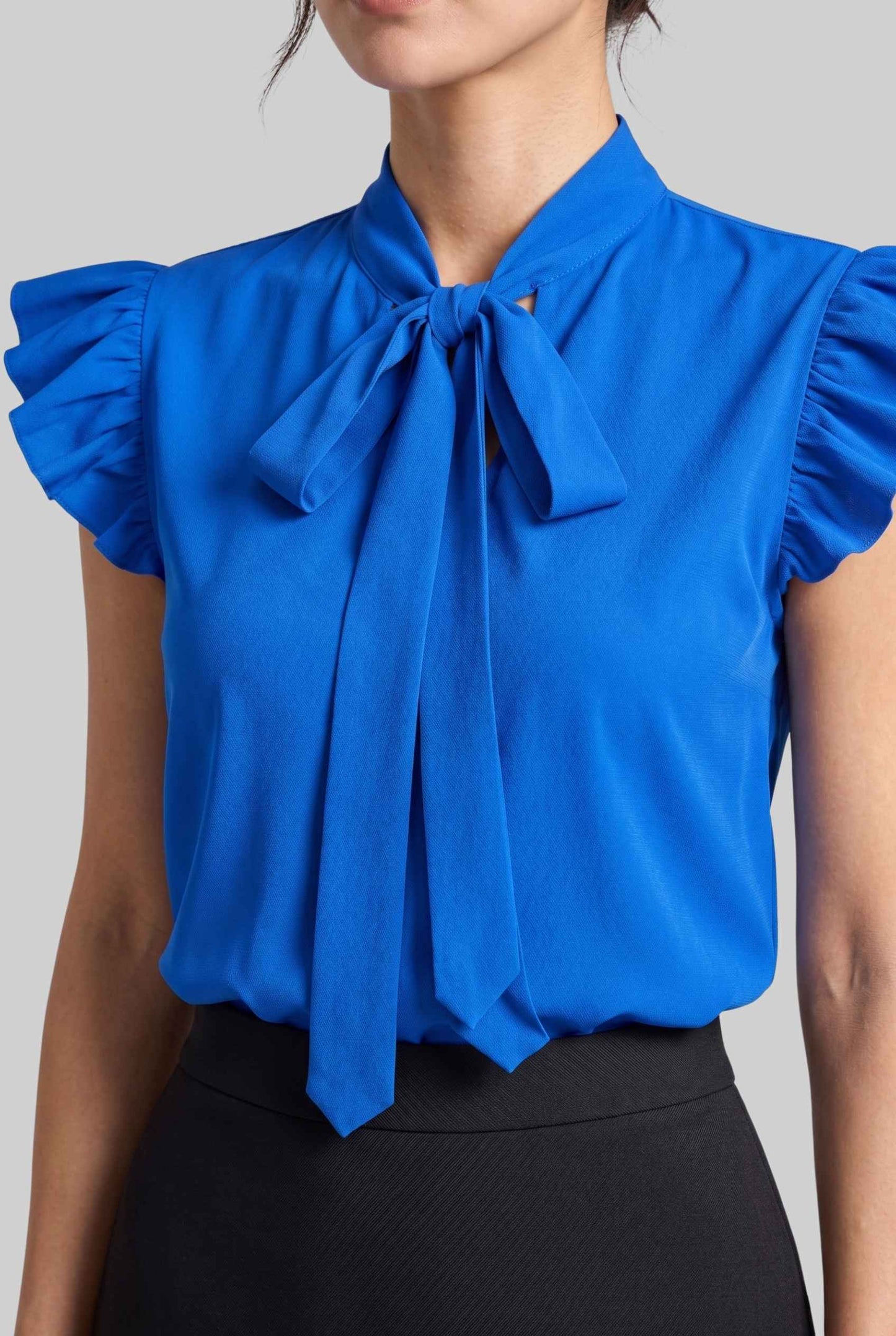 Virtual model wearing The Ramona Tied Blouse Bow Tie-Up Flutter Sleeve Blouse in Blue