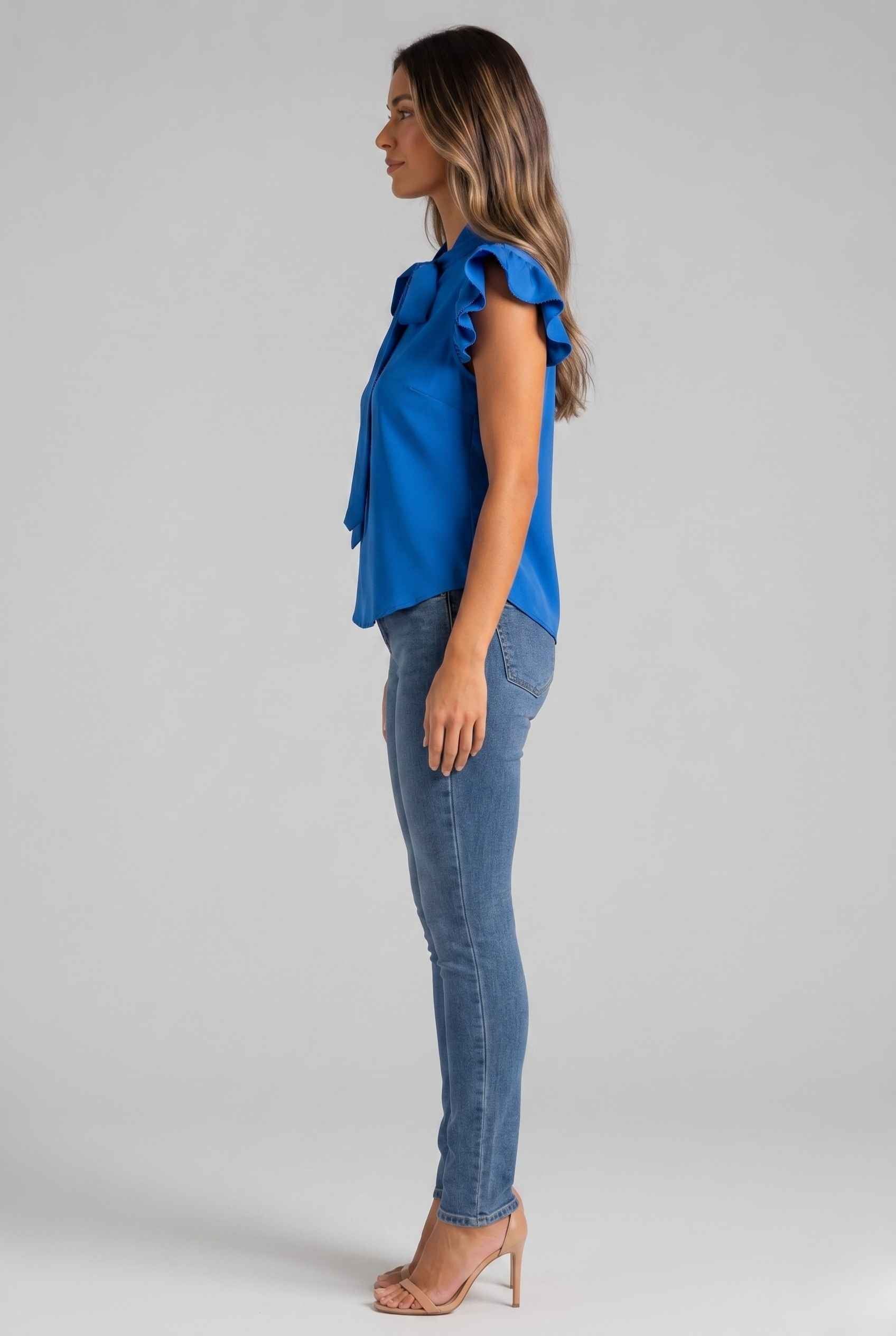Virtual Modal wearing The Ramona Tied Blouse Tie-Neck Flutter Blue Sleeve Blouse