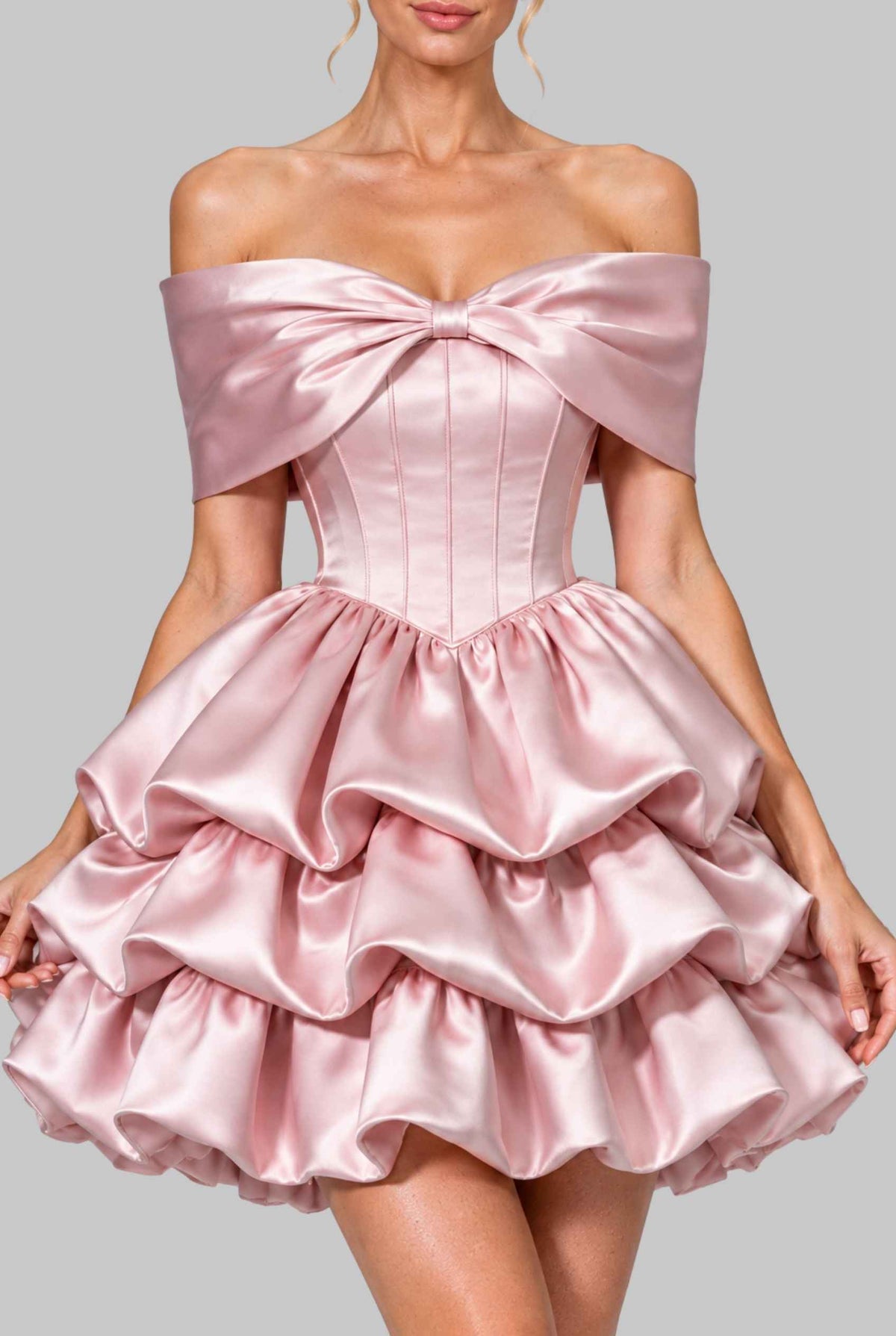 Virtual model wearing The Rosabelle Bow Tiered Dress Satin Tie-Up Corset Mini Ball Gown in Blush