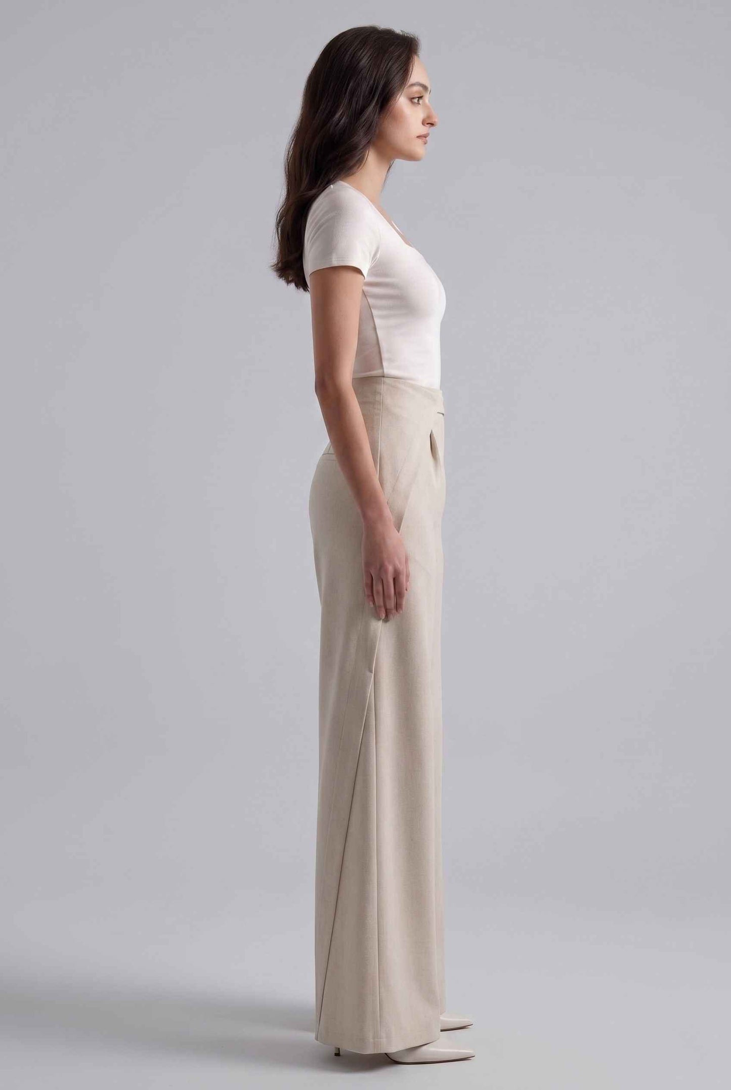 Virtual Model wearing The Rowan Wide-Leg Trouser Asymmetric Beige Pleated Pant