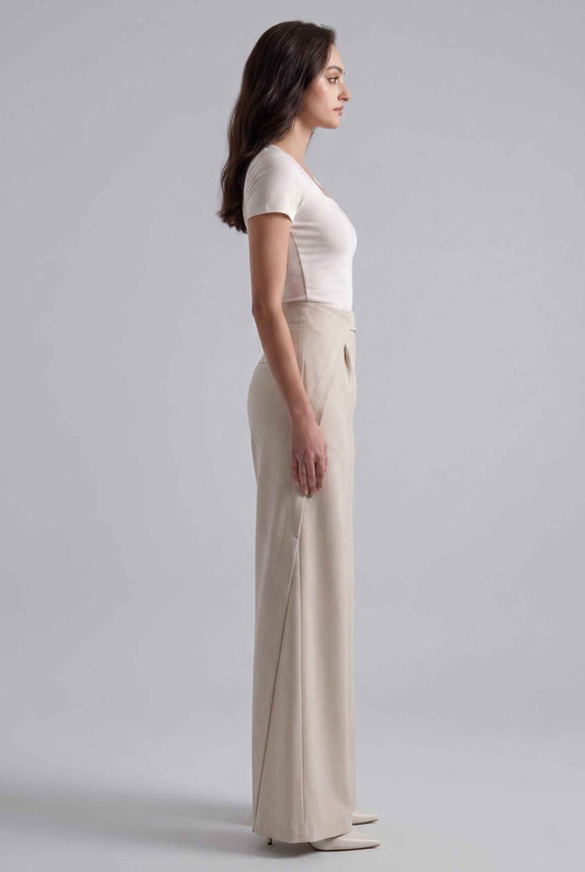 Virtual Model wearing The Rowan Wide-Leg Trouser Asymmetric Beige Pleated Pant