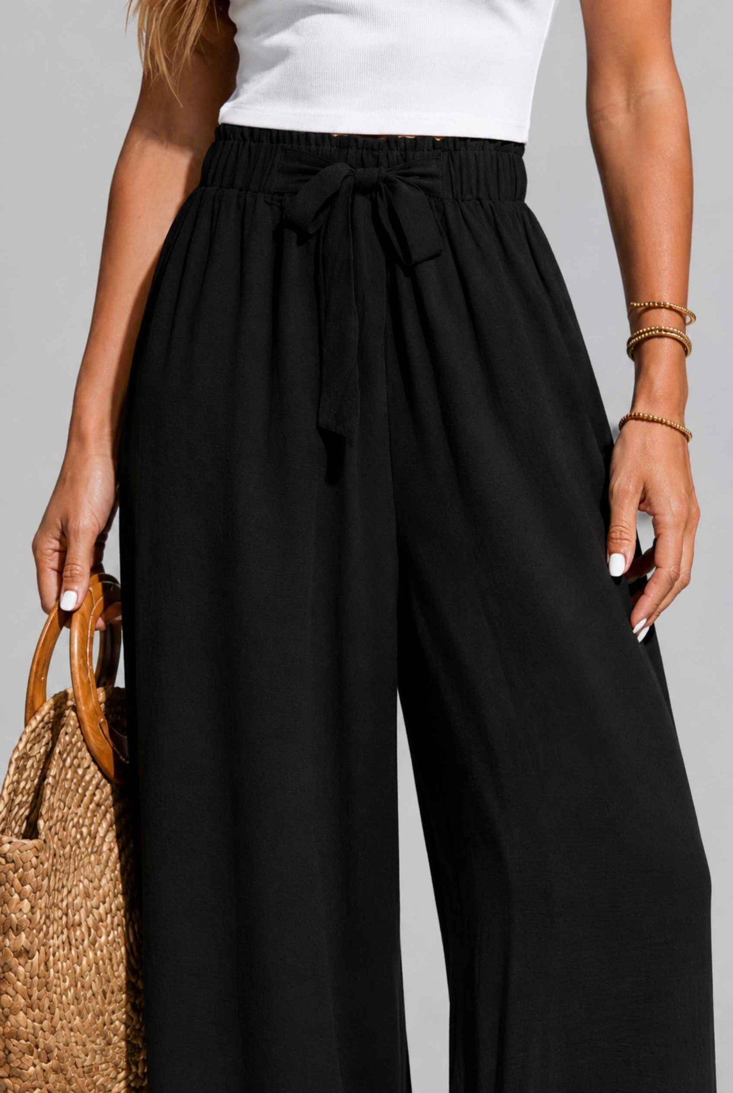 Virtual Model wearing The Savannah Textured Pant Wide Leg Paperbag Black Resort Pant