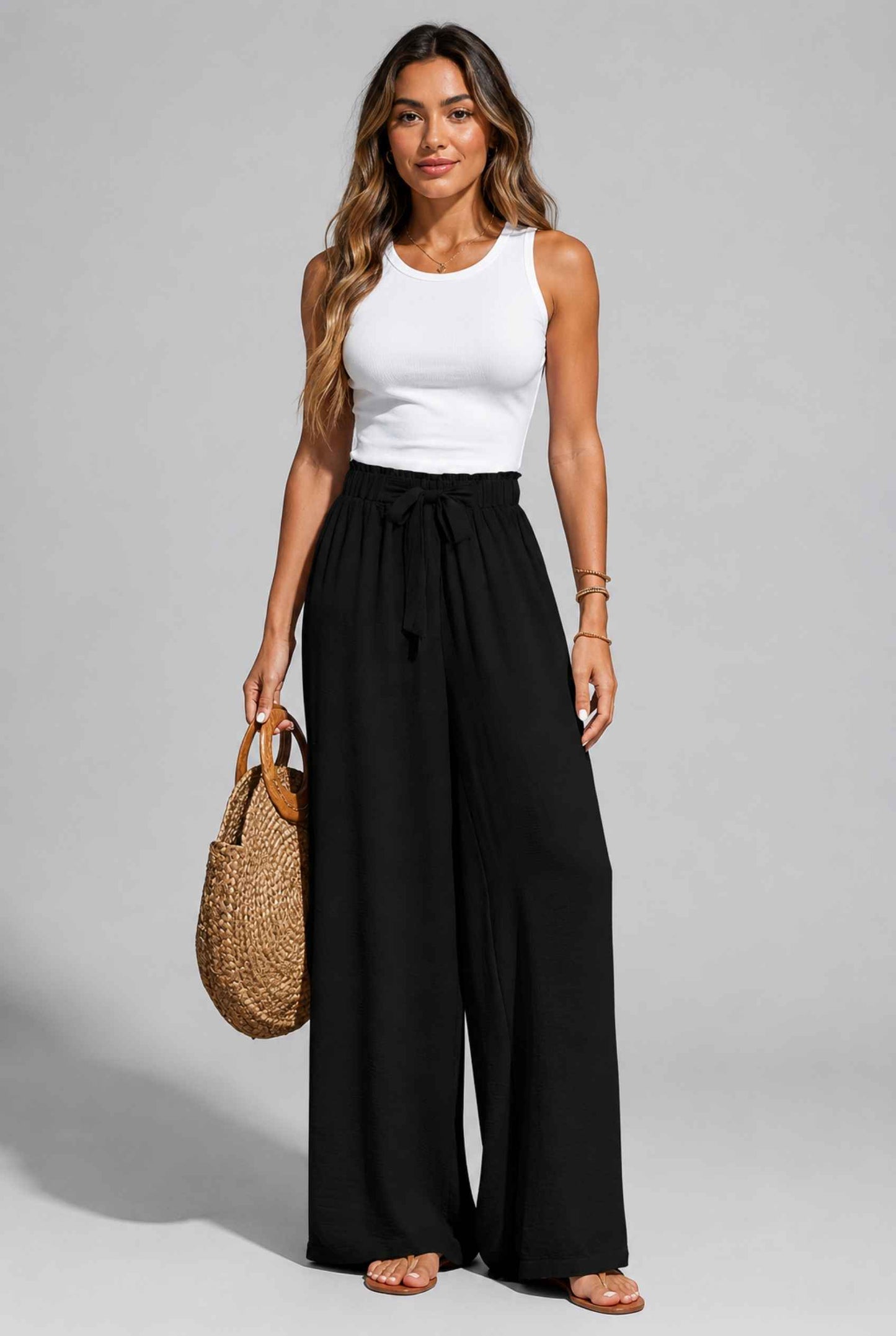 Virtual Model wearing The Savannah Textured Pant Wide Leg Paperbag Black Resort Pant