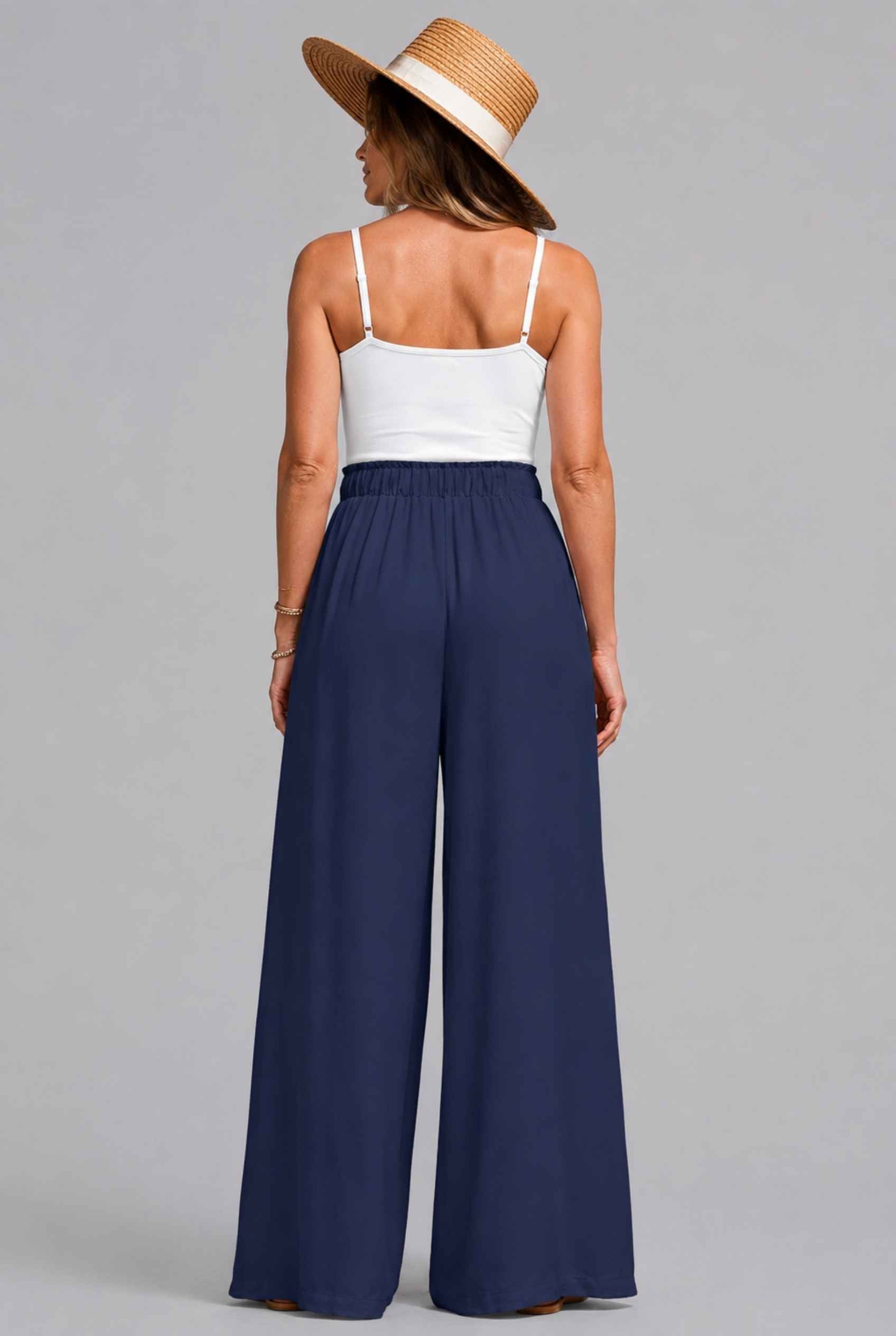 Virtual Model wearing The Savannah Textured Pant Wide Leg Paperbag Navy Resort Pant