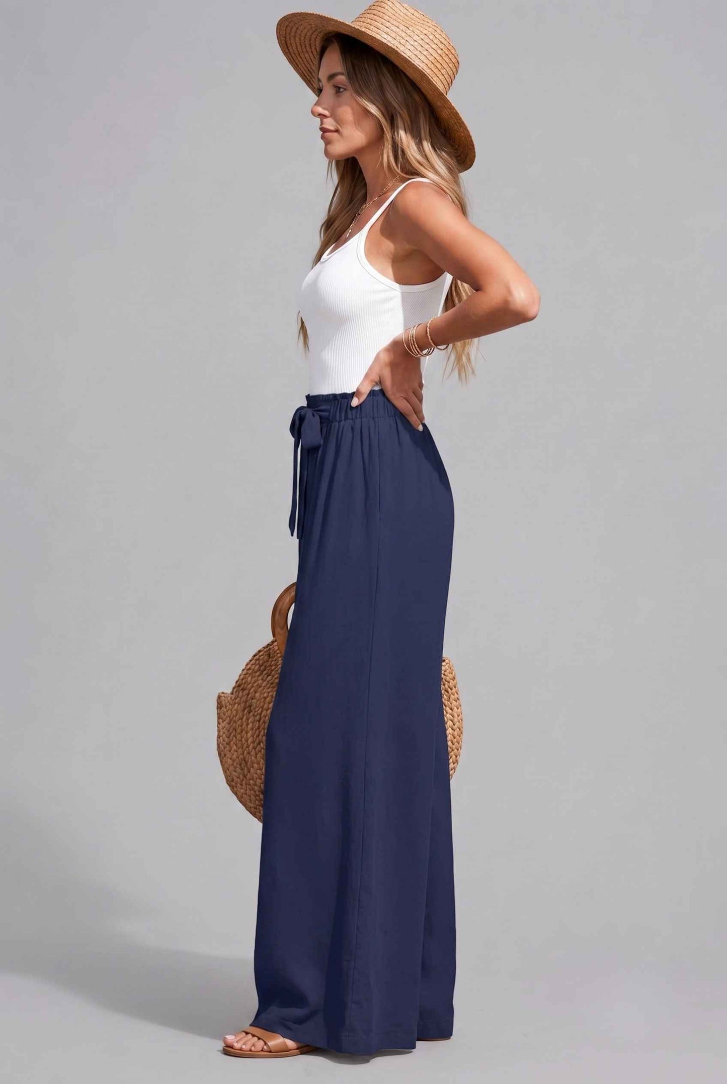 Virtual Model wearing The Savannah Textured Pant Wide Leg Paperbag Navy Resort Pant