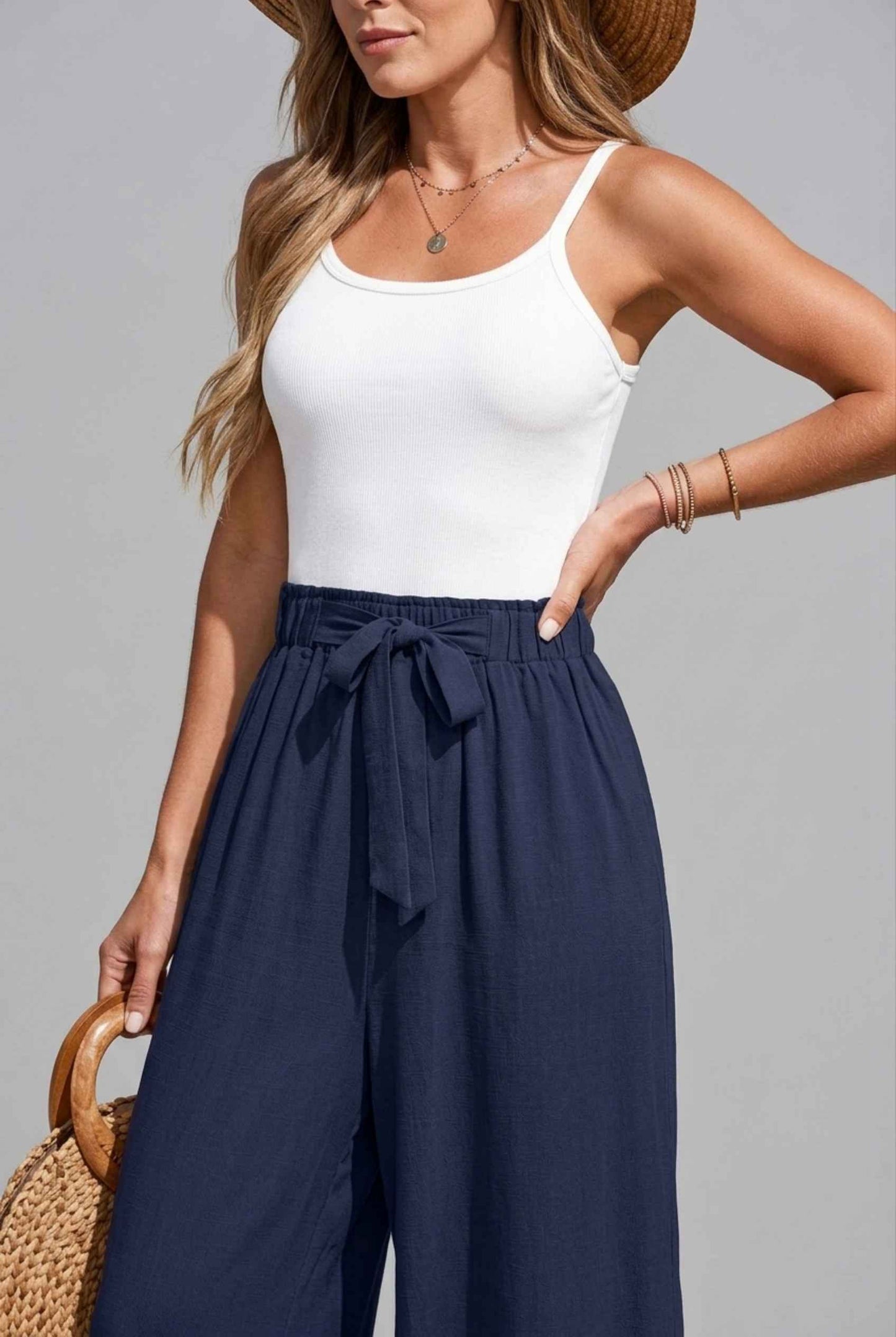 Virtual Model wearing The Savannah Textured Pant Wide Leg Paperbag Navy Resort Pant