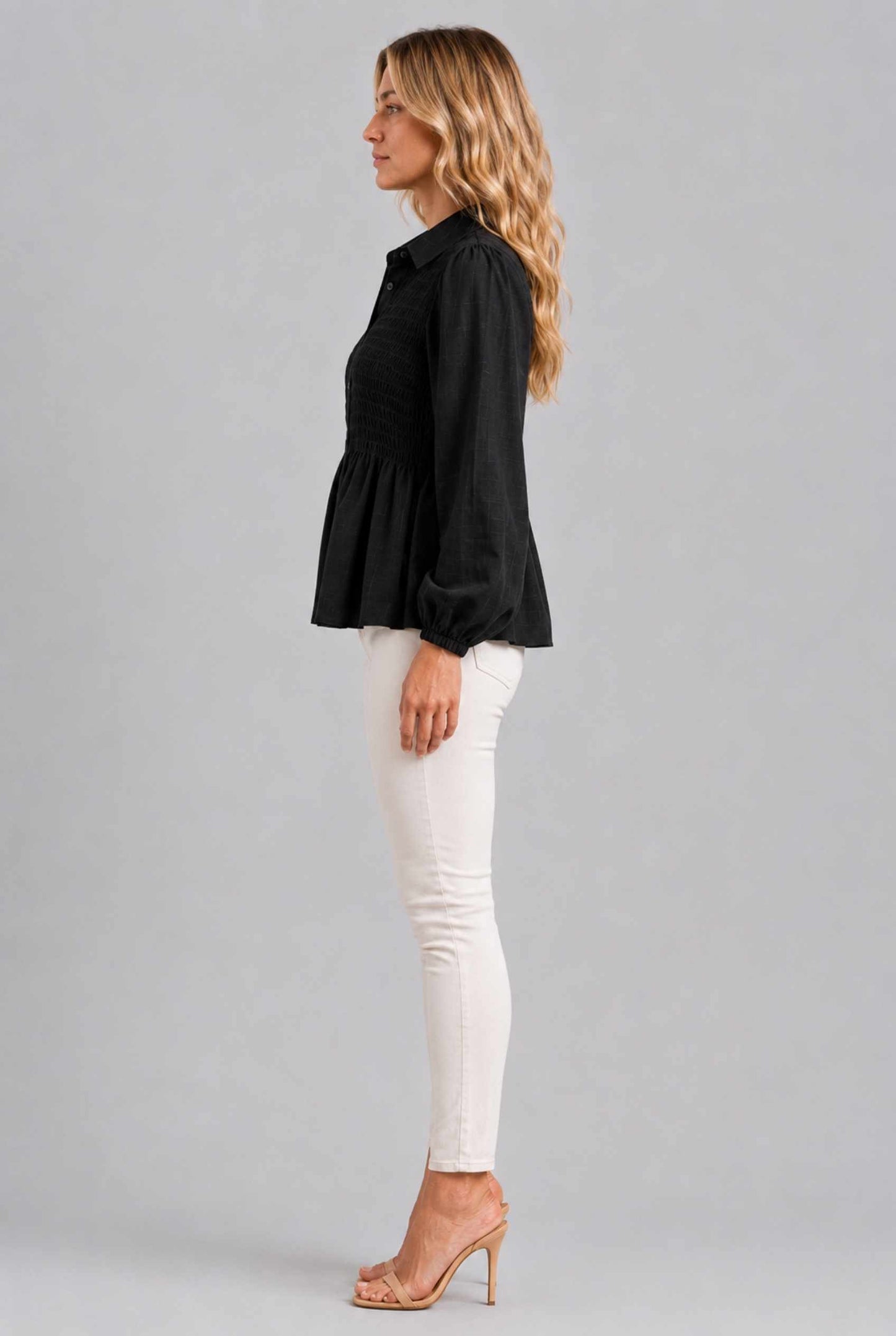 Virtual Model wearing The Sutton Peplum Blouse Black Smocked Button-Down Top