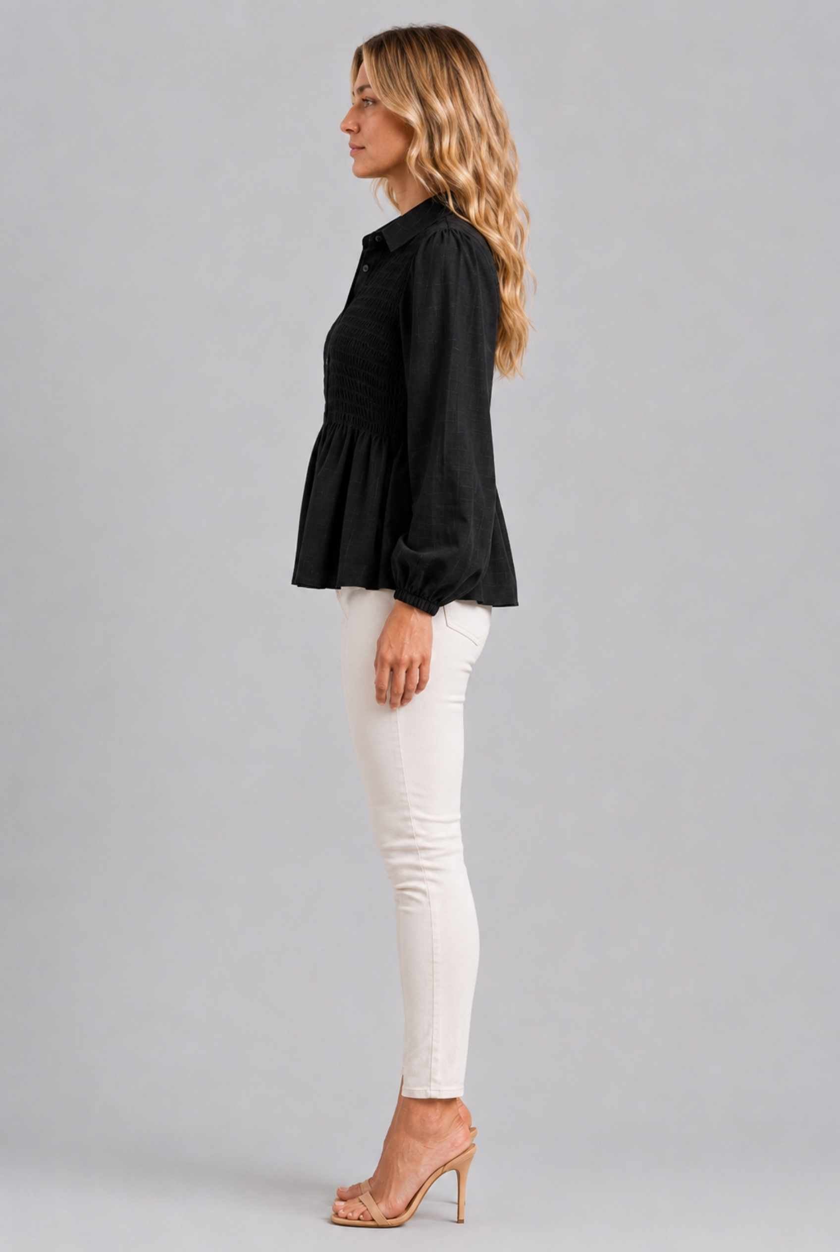 Virtual Model wearing The Sutton Peplum Blouse Black Smocked Button-Down Top