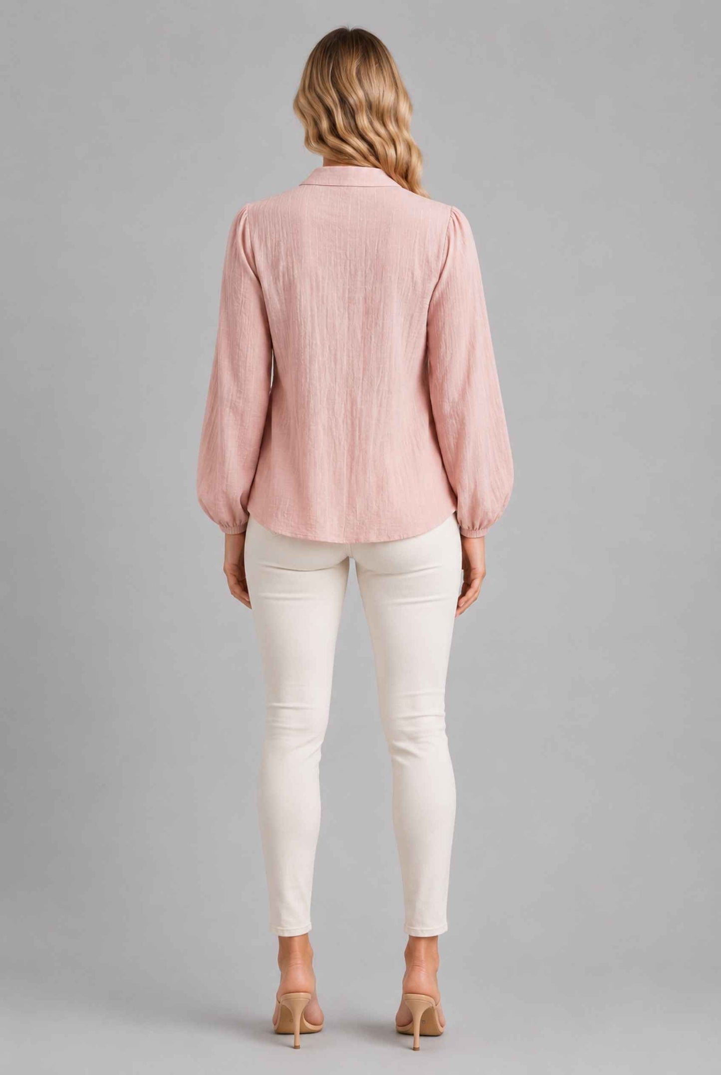 Virtual Model wearing The Sutton Peplum Blouse Blush Pink Smocked Button-Down Top