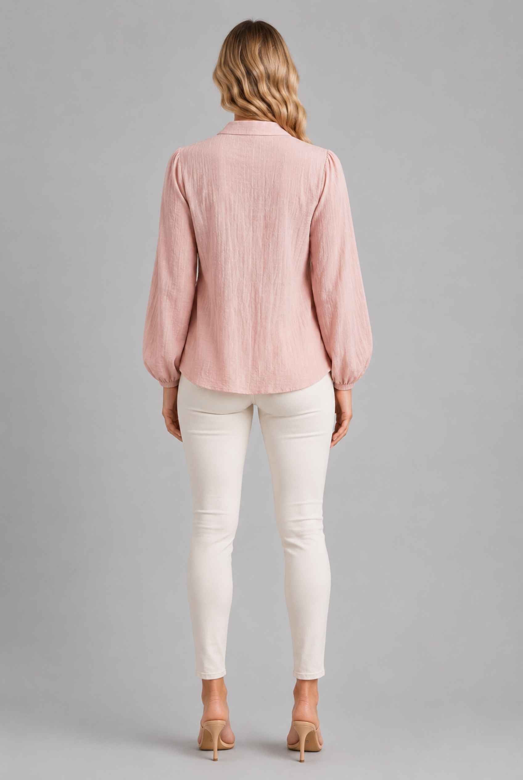 Virtual Model wearing The Sutton Peplum Blouse Blush Pink Smocked Button-Down Top