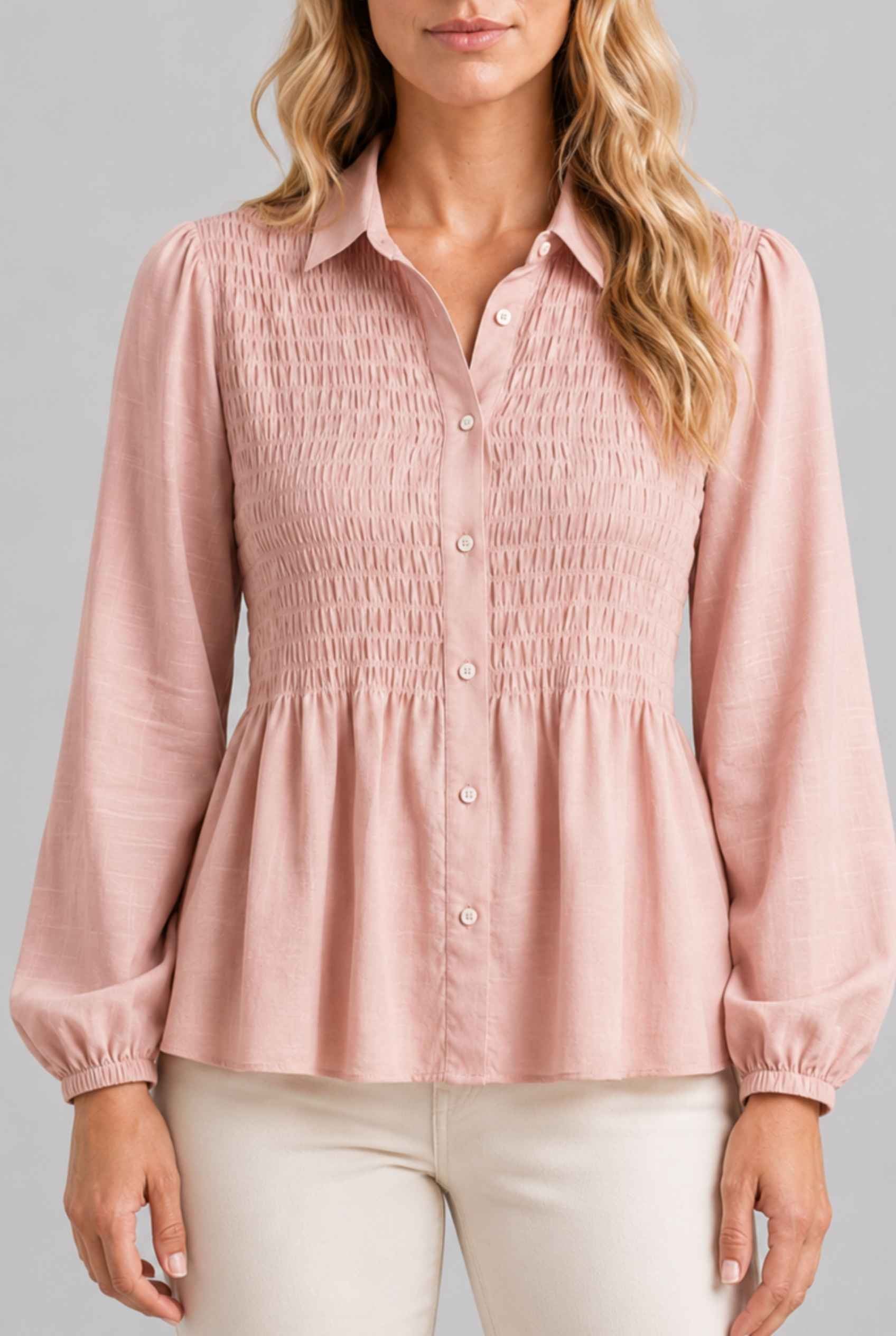 Virtual Model wearing The Sutton Peplum Blouse Blush Pink Smocked Button-Down Top