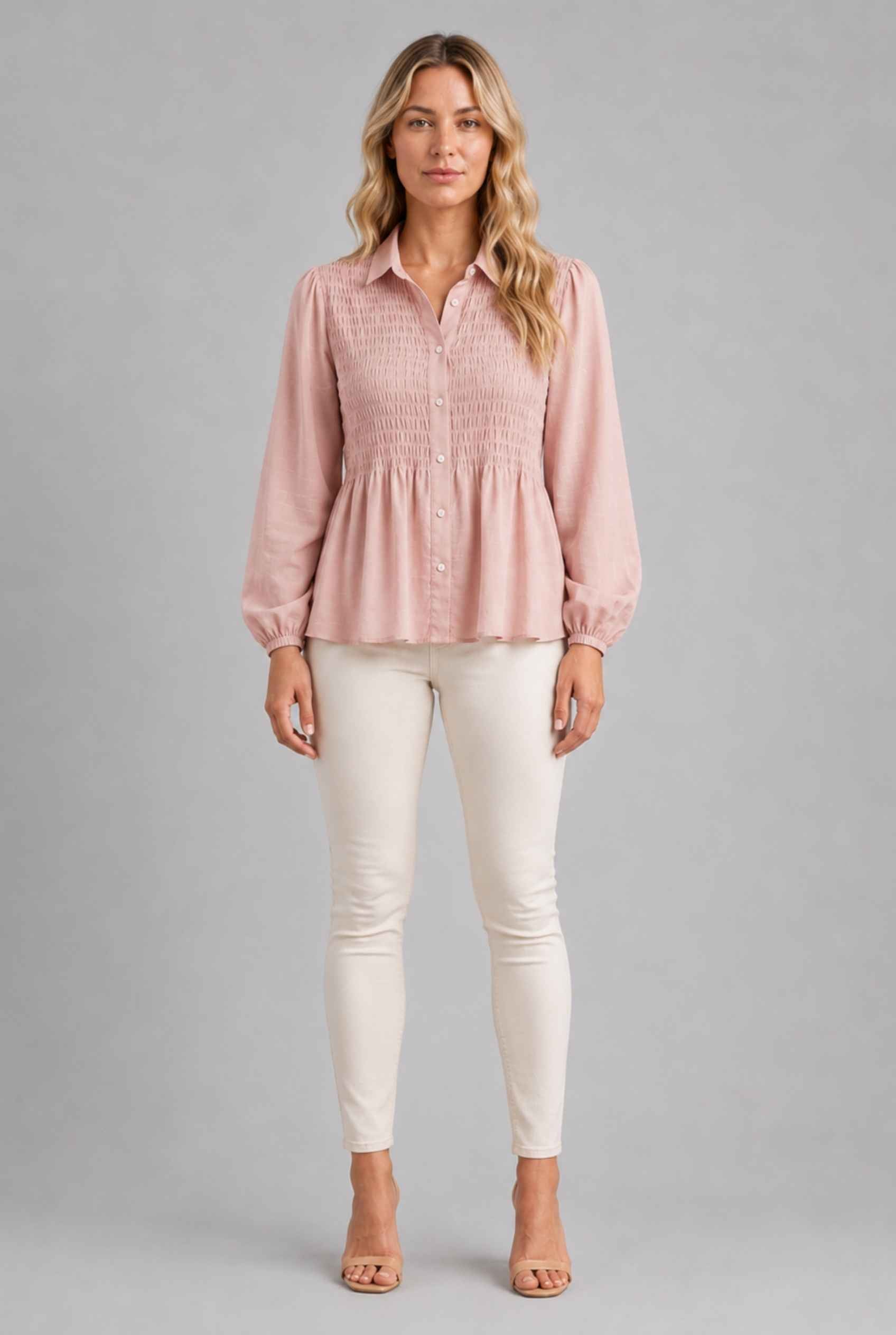 Virtual Model wearing The Sutton Peplum Blouse Blush Pink Smocked Button-Down Top