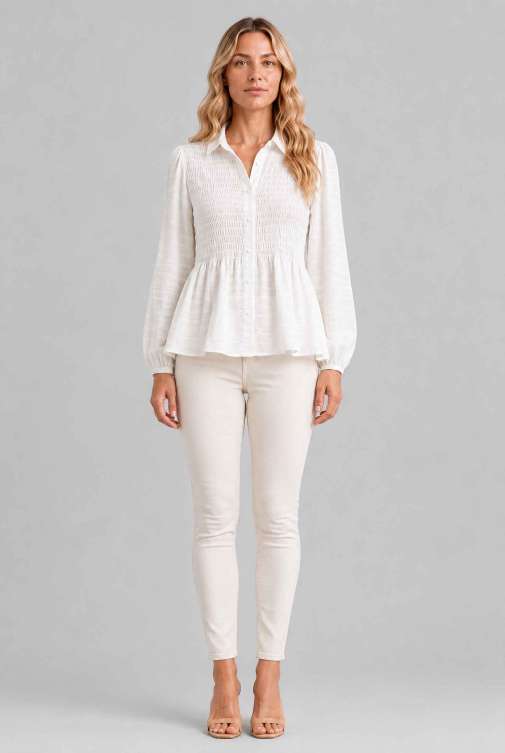 Virtual Model wearing The Sutton Peplum Blouse White Smocked Button-Down Top