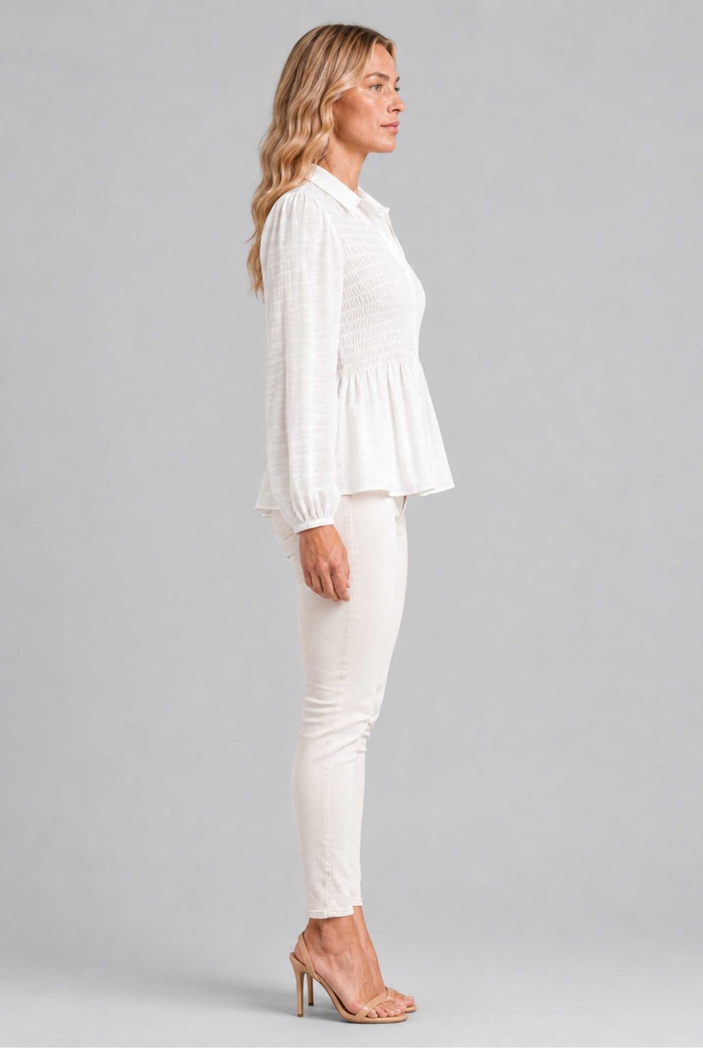 Virtual Model wearing The Sutton Peplum Blouse White Smocked Button-Down Top