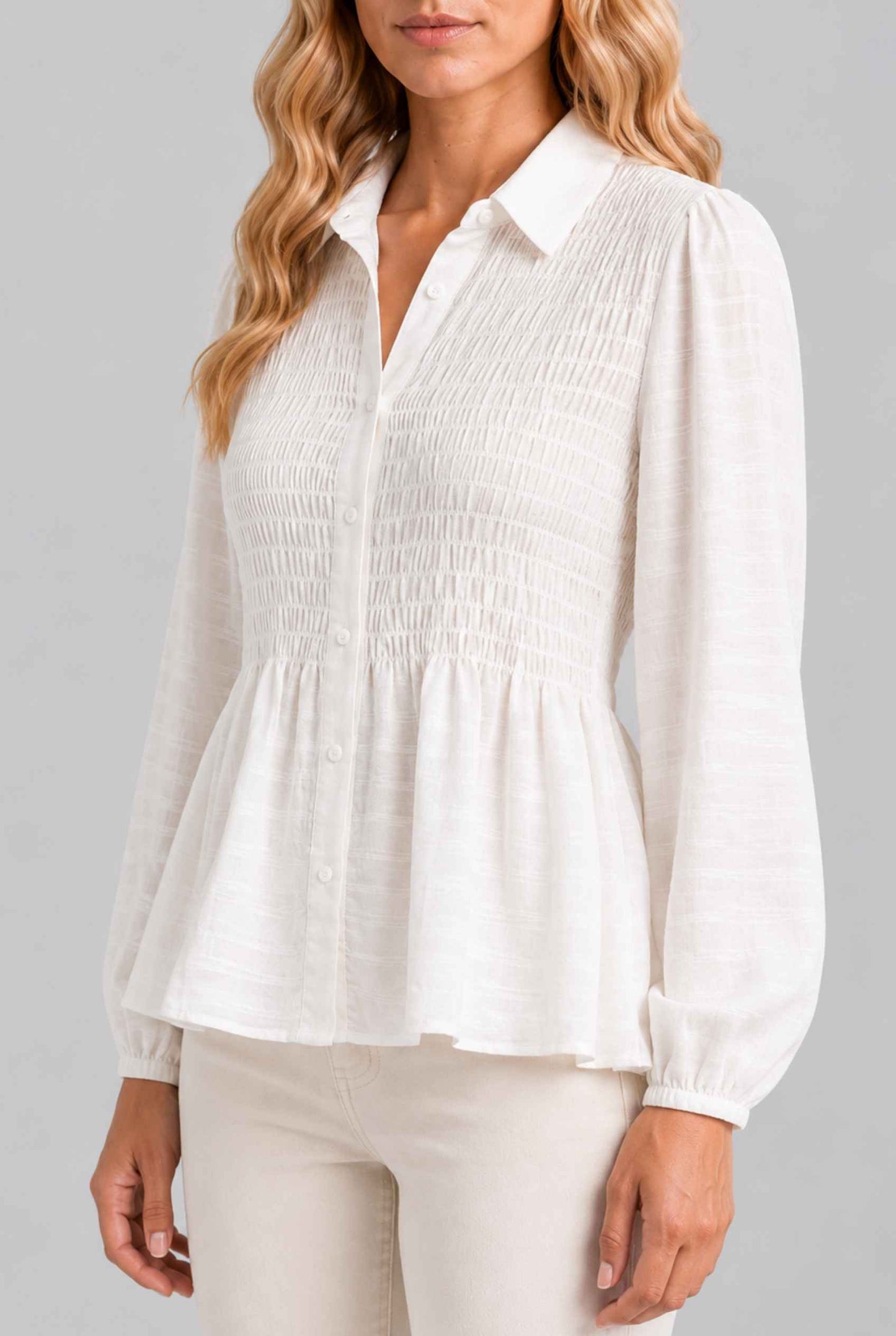 Virtual Model wearing The Sutton Peplum Blouse White Smocked Button-Down Top