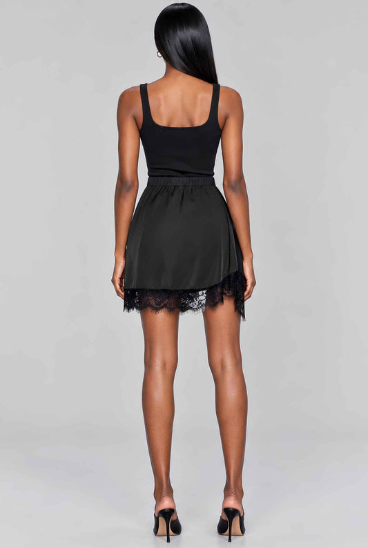 Virtual model wearing The Vera Lace Satin Mini Skirt Black Asymmetrical Lace Trim Wrap Skirt