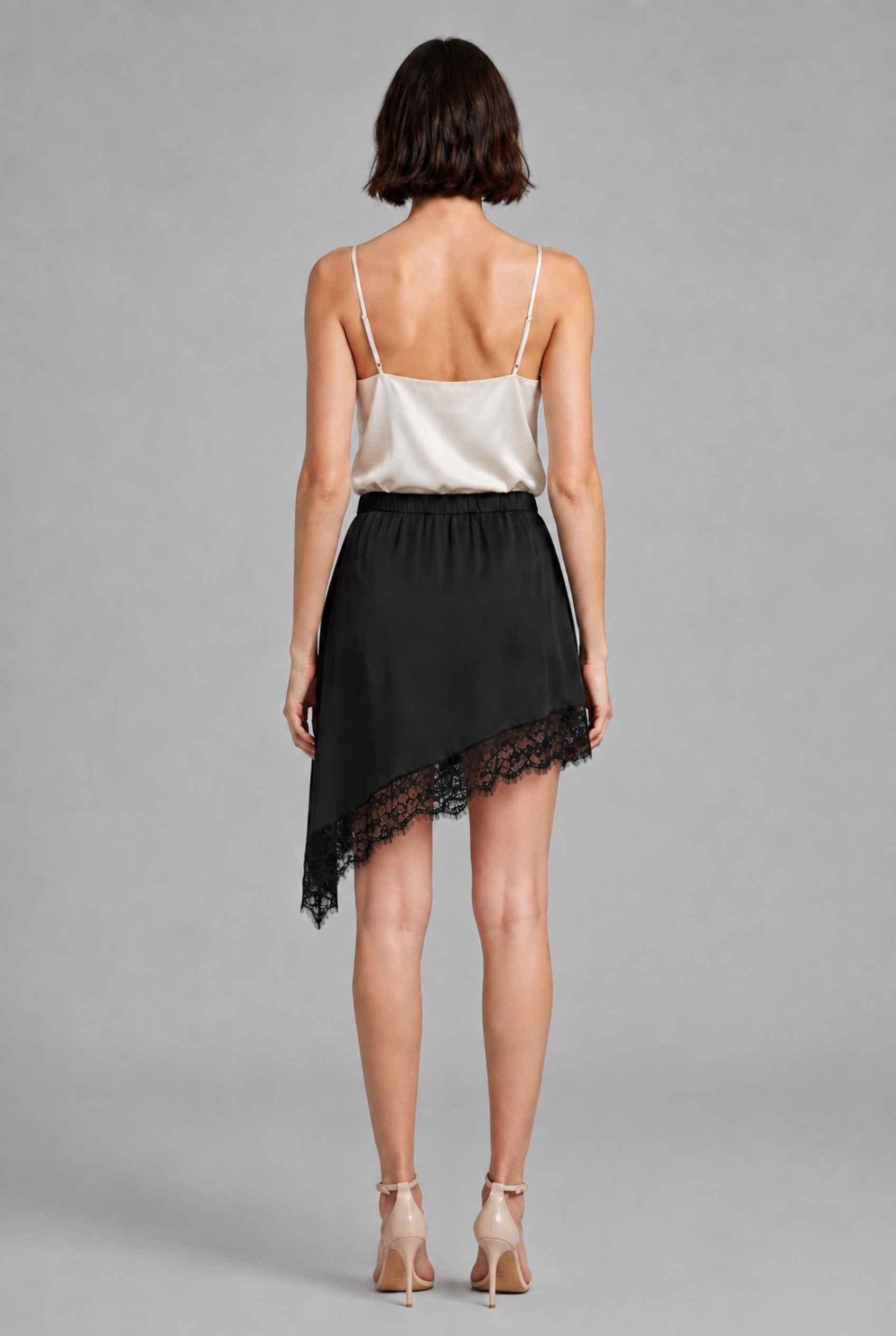 Virtual Model Wearing The Vera Lace Satin Mini Skirt Asymmetrical Lace Trim Black Wrap Skirt