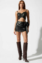 The Vesper Faux Leather Bow Mini Skirt
