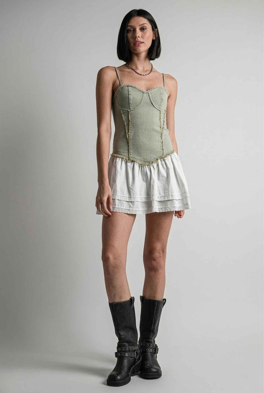 Model wearing Willow Mini in Light Green Denim with cotton tiers dress paired with combat boots