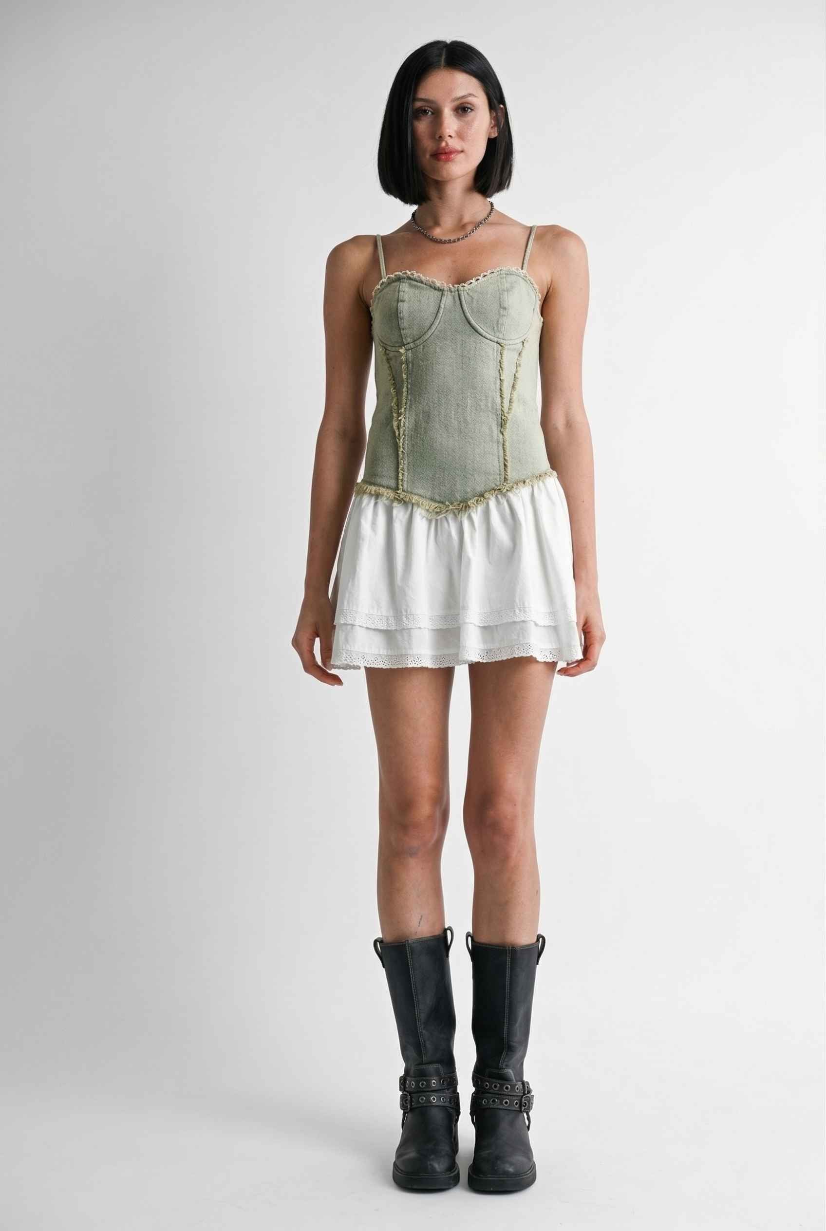 Model wearing Willow Mini in Light Green Denim with cotton tiers dress paired with combat boots