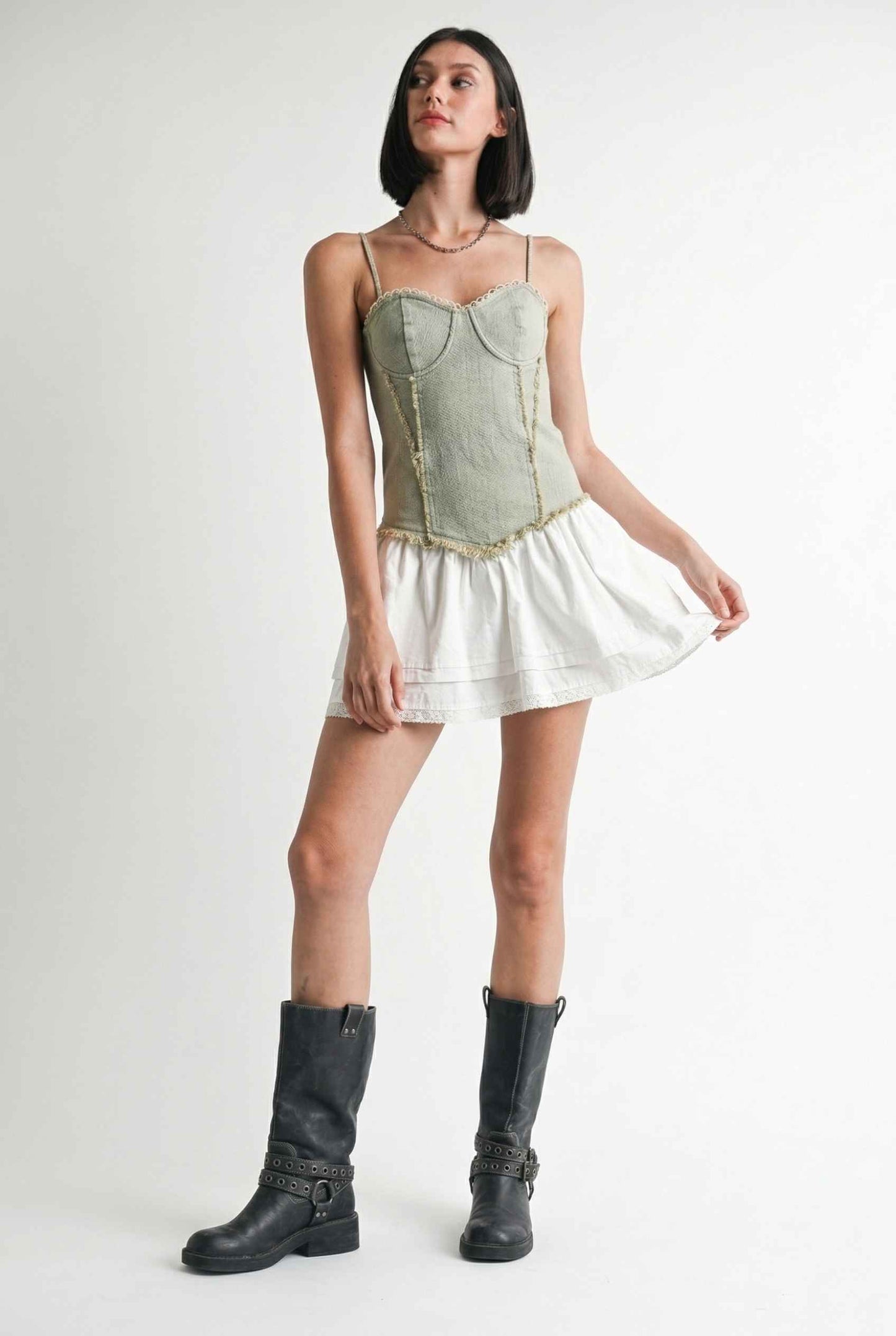Model wearing Willow Mini in Light Green Denim with cotton tiers dress paired with combat boots