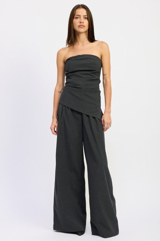 Emory Park Asymmetrical Bustier Tube Top in dark gray, paired with wide-leg pants for a chic look