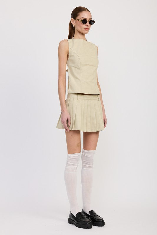 Emory Park beige sleeveless Backless Rider Top paired with matching pleated skirt and white thigh-high socks