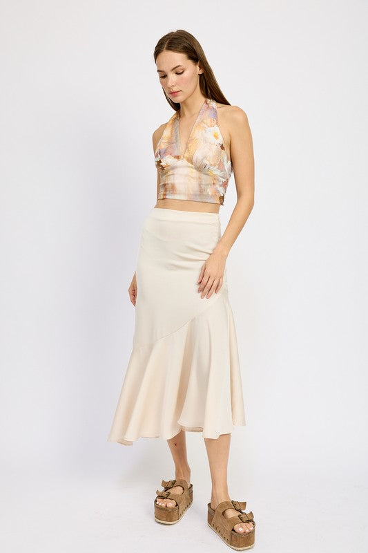 Emory Park beige asymmetrical ruffle hem skirt worn with floral halter top and platform sandals