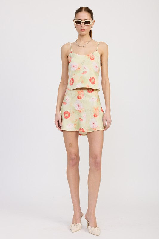 Model wearing Emory Park Bias Cut Mini Satin Skirt with floral pattern and matching cami top