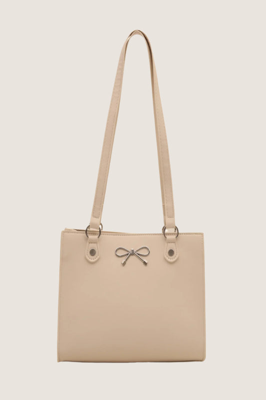 Bow detail shoulder bag in beige with elegant bow accent and adjustable straps