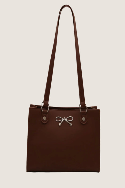 Stylish brown bow detail shoulder bag with adjustable straps and silver accents