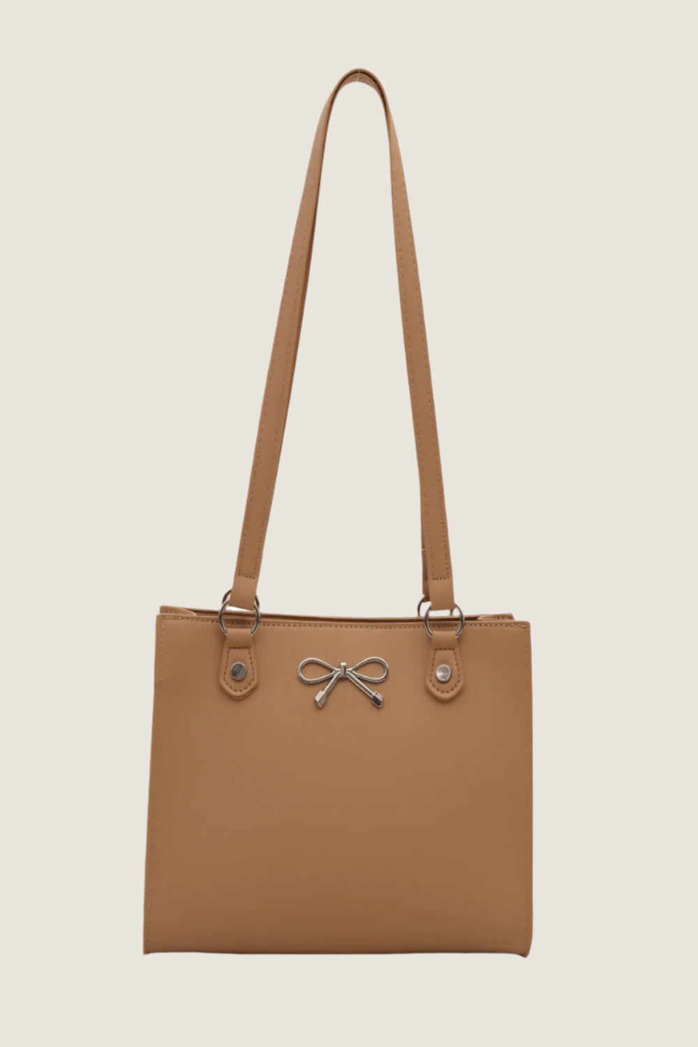 Bow detail shoulder bag in tan with stylish bow accent and sturdy shoulder straps