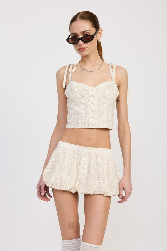 Emory Park Bubble Mini Skirt With Elastic Waistband in cream eyelet fabric paired with matching buttoned crop top