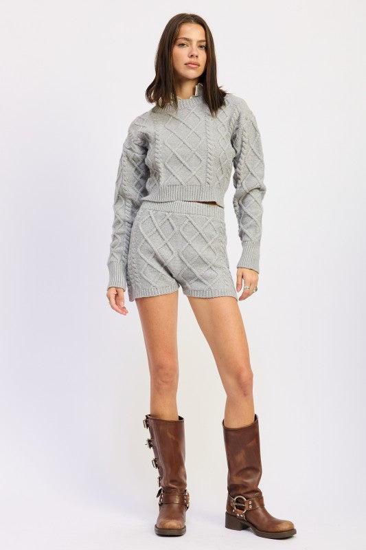 Gray Cable Knit Cropped Sweater by Emory Park featuring ribbed cuffs and stylish, textured design