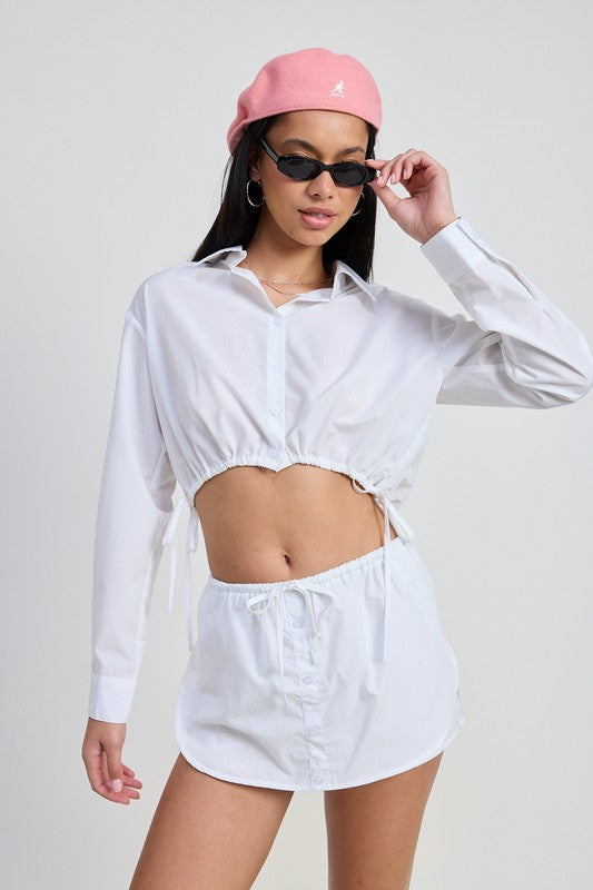 Emory Park Cinched Mini Skort With Drawstring in white worn with matching cropped shirt and pink beret