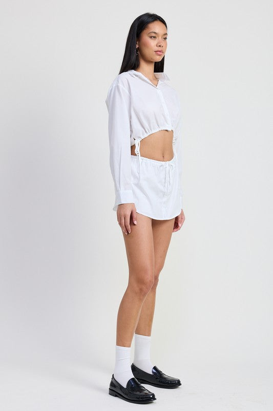 Emory Park white Cinched Mini Skort With Drawstring worn by model with matching cropped hoodie and black loafers