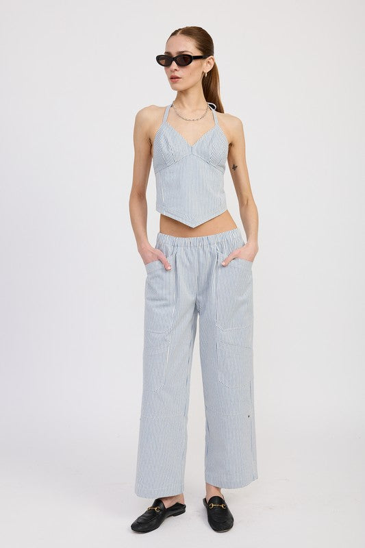 Woman wearing Emory Park Cinched Twill Pants With Wide Leg in light blue with pockets