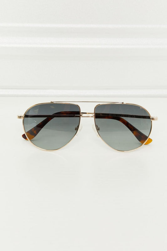 Classic aviator sunglasses with dark lenses and stylish tortoise shell frame
